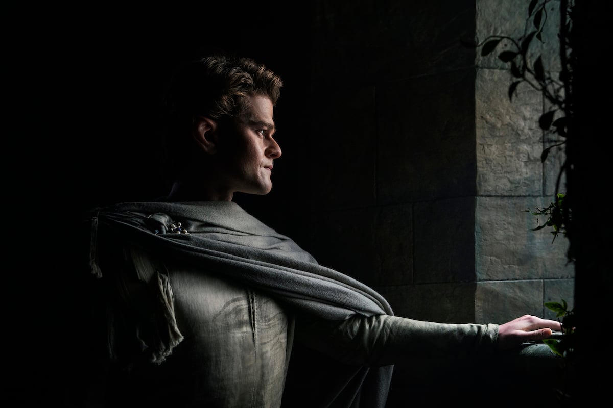 'Rings of Power': Elrond actor Robert Aramayo looks out the window with his arms outstretched