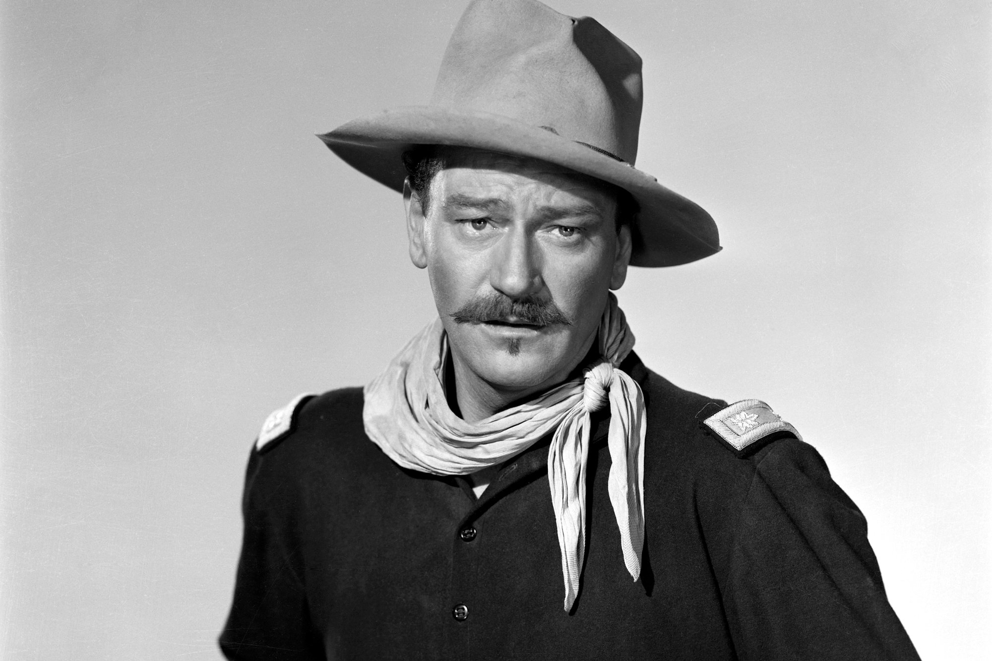 'Rio Grande' John Wayne as Lt. Col. Kirby Yorke with a mustache and wearing a Western hat and costume