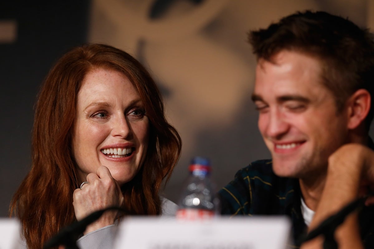 Robert Pattinson and Julianne Moore at a press conference.