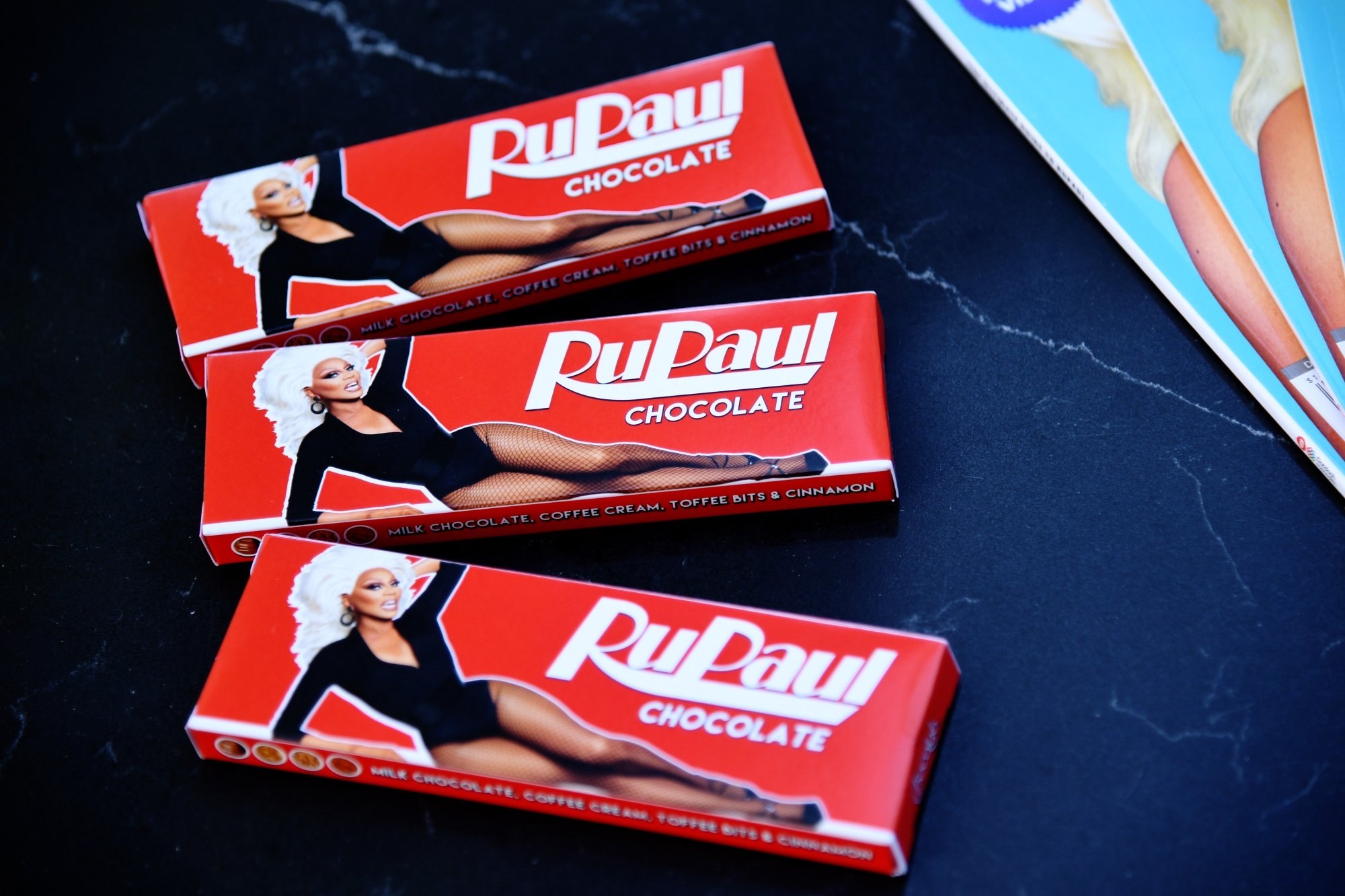'RuPaul's Drag Race' Season 14 chocolate candy bars. The red wrappers have an image of RuPaul laying on her side.