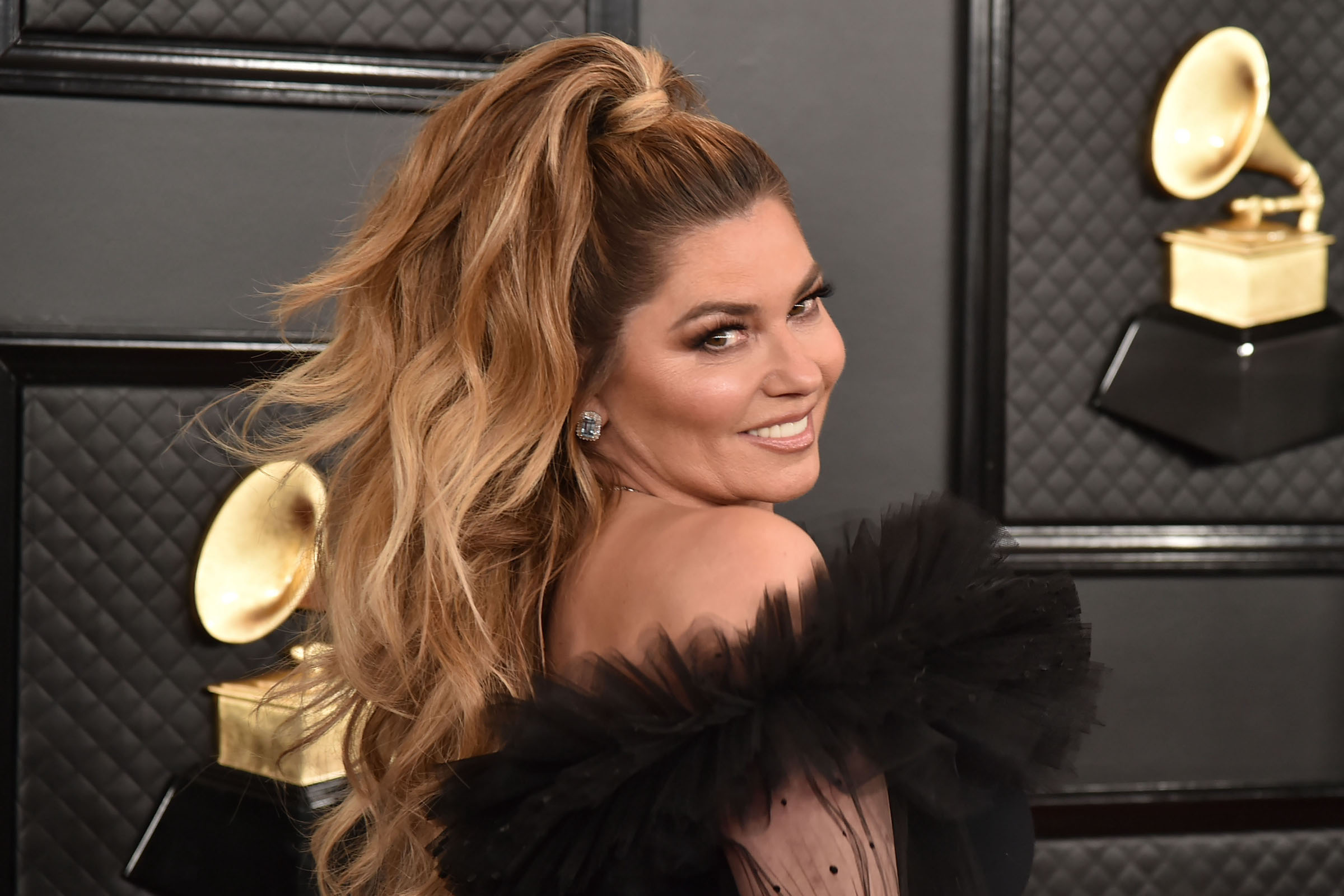 Shania Twain, who has an album and tour on the way, wearing a black dress