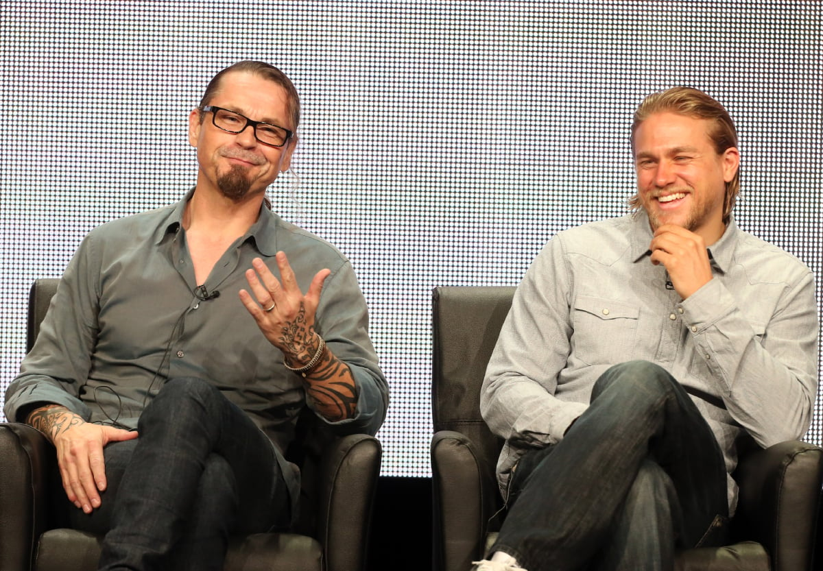 Sons of Anarchy Kurt Sutter and star Charlie Hunnam speak onstage during the "Sons of Anarchy" panel discussion at the FX portion of the 2013 Summer Television Critics Association tour - Day 10 at The Beverly Hilton Hotel on August 2, 2013