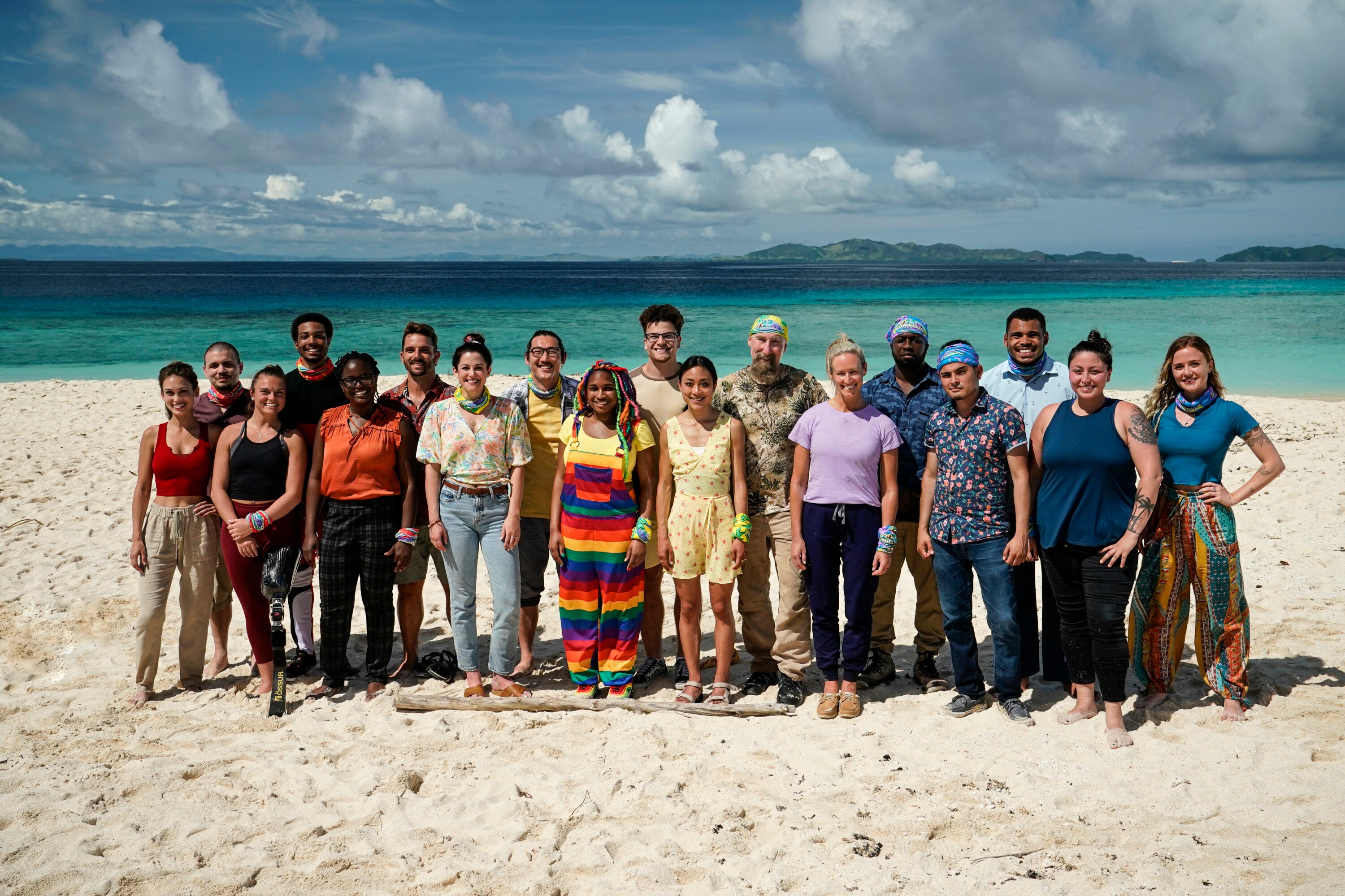 The 'Survivor' Season 43 cast, including Justine Brennan, Jesse Lopez, Noelle Lambert, Dwight Moore, Nneka Ejere, Cody Assenmacher, Elie Scott, Owen Knight, Morriah Young, Sami Layadi, Jeanine Zheng, Mike Gabler, Lindsay Carmine, James Jones, Geo Bustamante, Ryan Medrano, Karla Cruz Godoy, and Cassidy Clark, pose for a group picture on the beach.