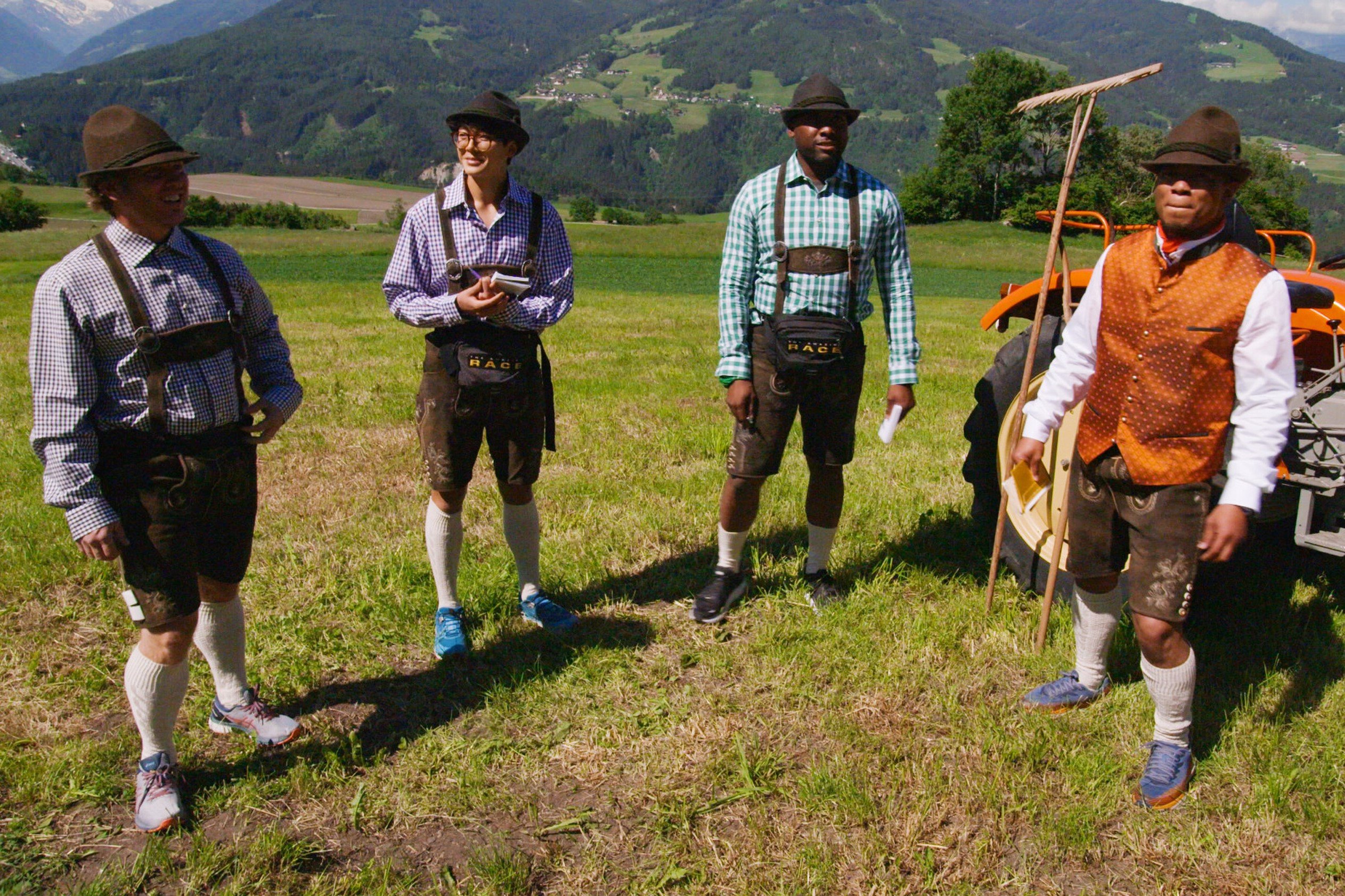 Tim Mann, Derek Xiao, Marcus Craig, and Lumumba Roberts, who compete in ' The Amazing Race' Season 34 on CBS, are surrounded by mountains in Austria, wearing