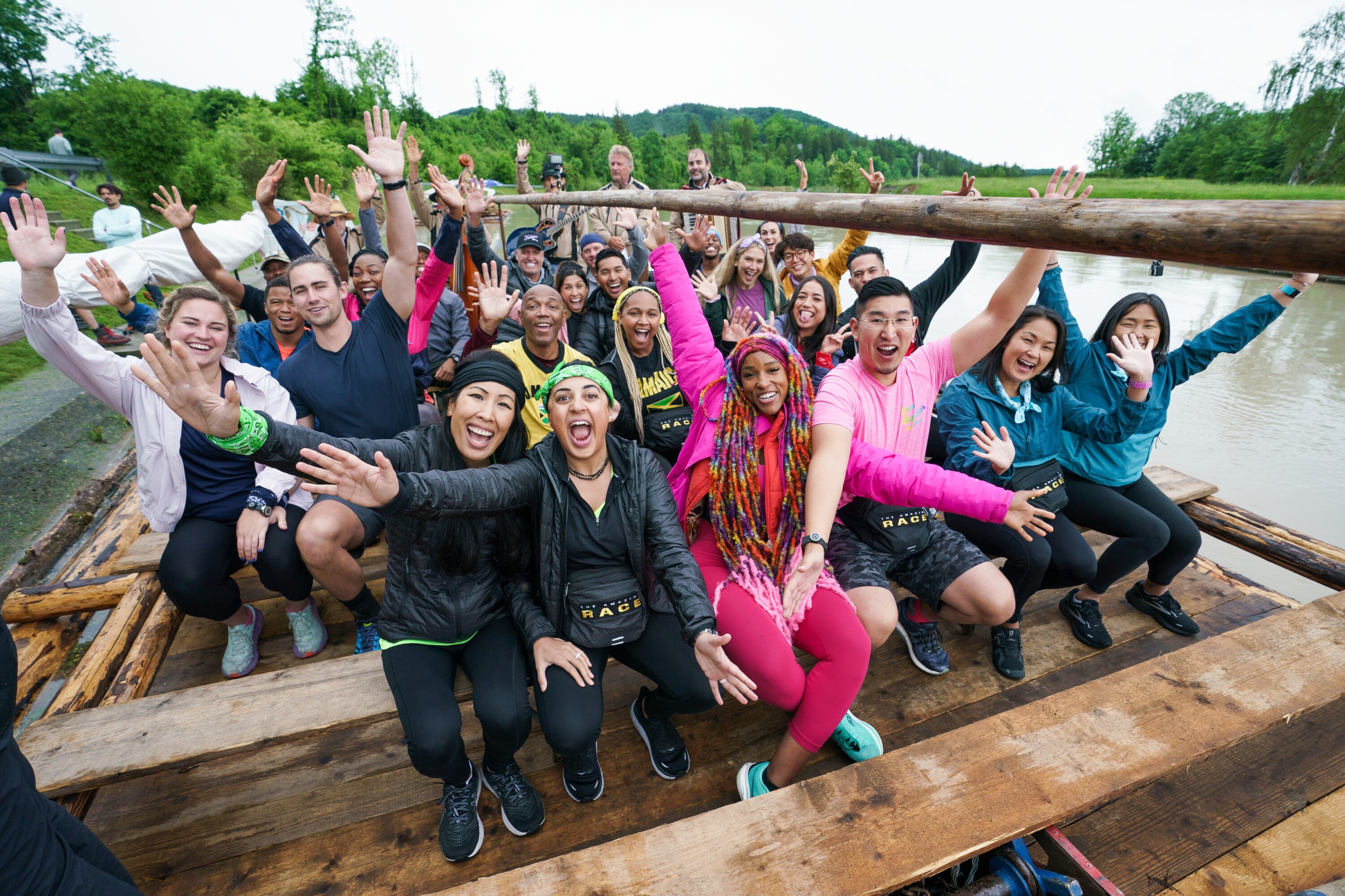 The cast of 'The Amazing Race' Season 34, which premieres tonight, Sept. 21, pose for a picture on a boat.