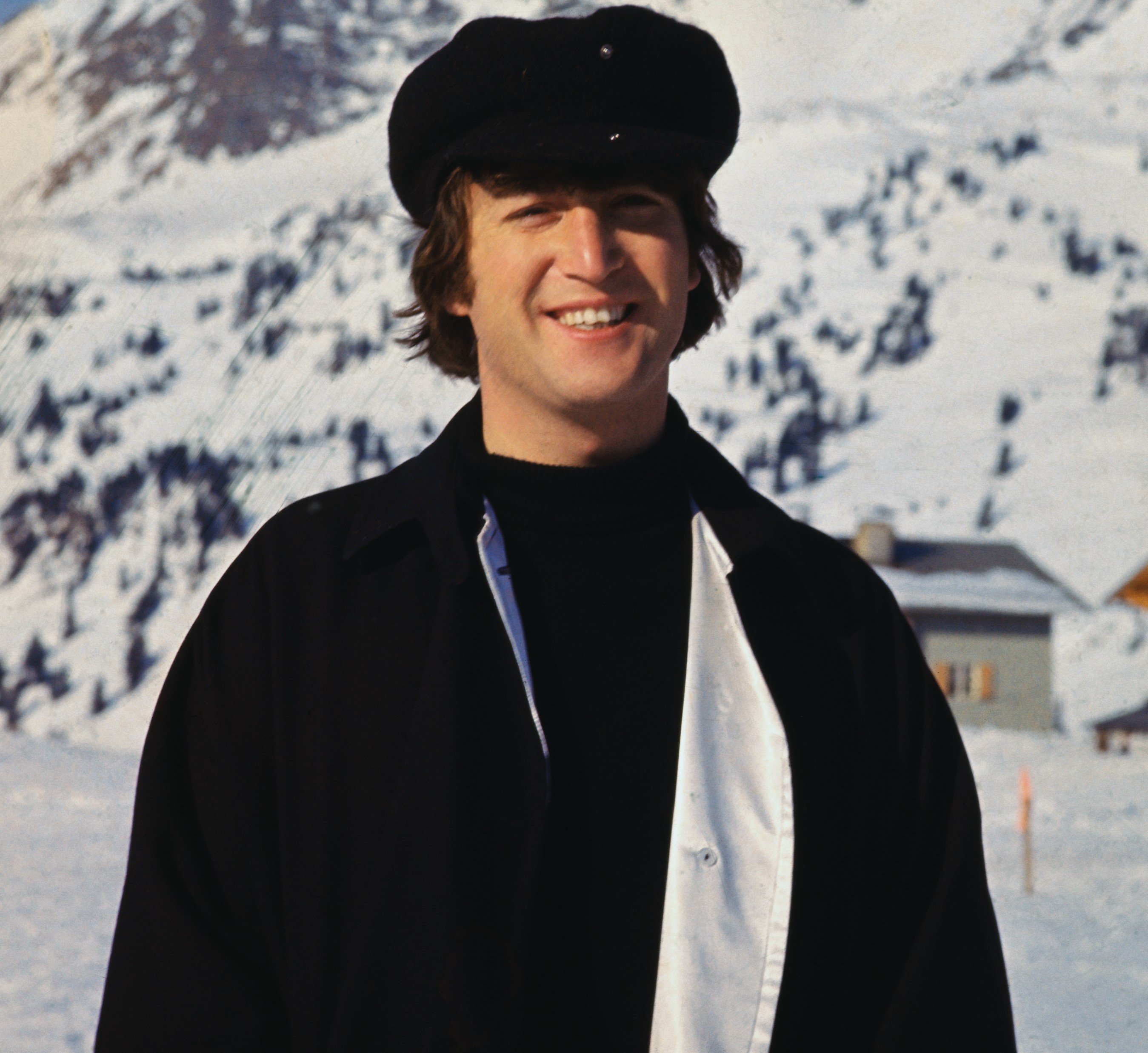 John Lennon posing for The Beatles' 'Help!' in a snowy area