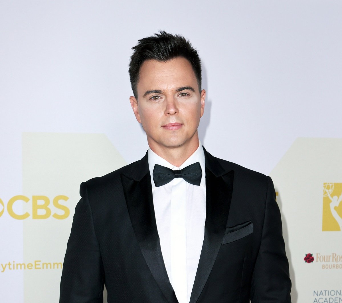 'The Bold and the Beautiful' actor Darin Brooks in a tuxedo poses for a photo on the red carpet.