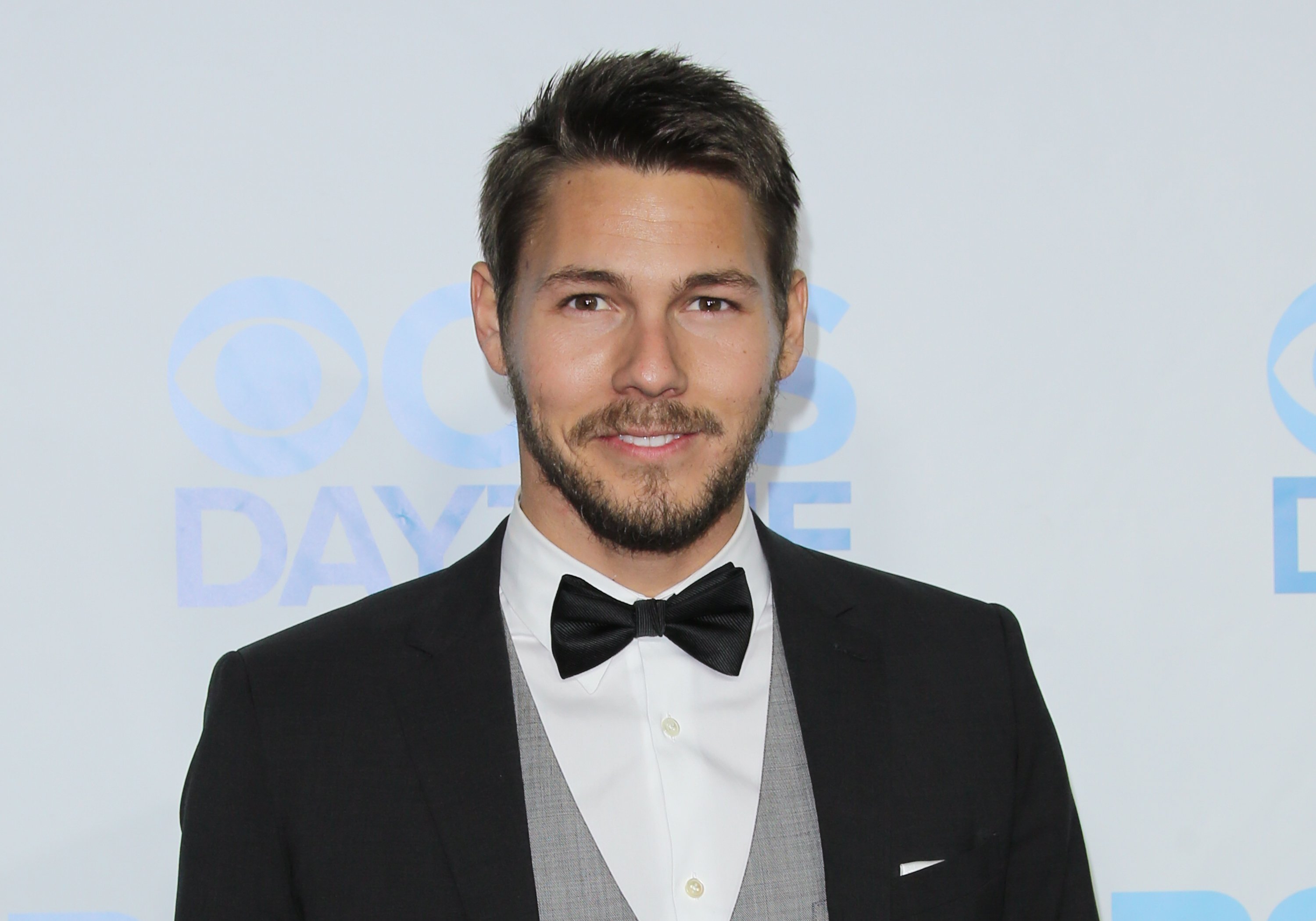 'The Bold and the Beautiful' star Scott Clifton dressed in a tuxedo poses for a photo during the show's anniversary celebration.