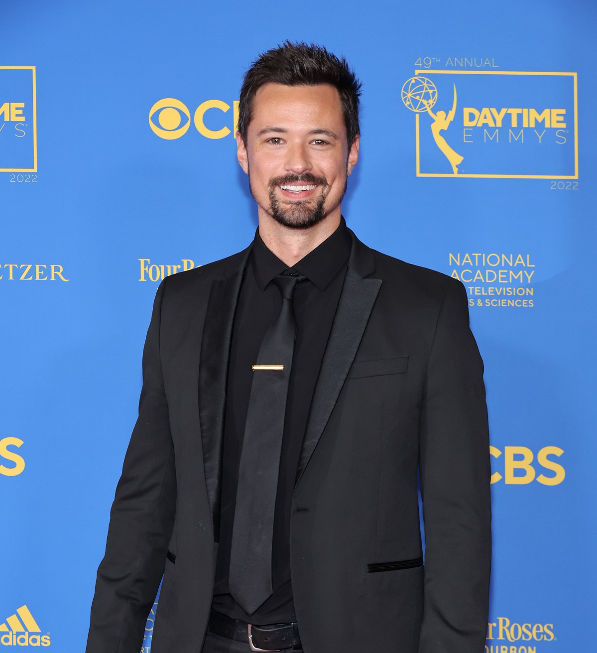 'The Bold and the Beautiful' star Matthew Atkinson wearing a black suit, poses for a photo during he 2022 Daytime Emmys.