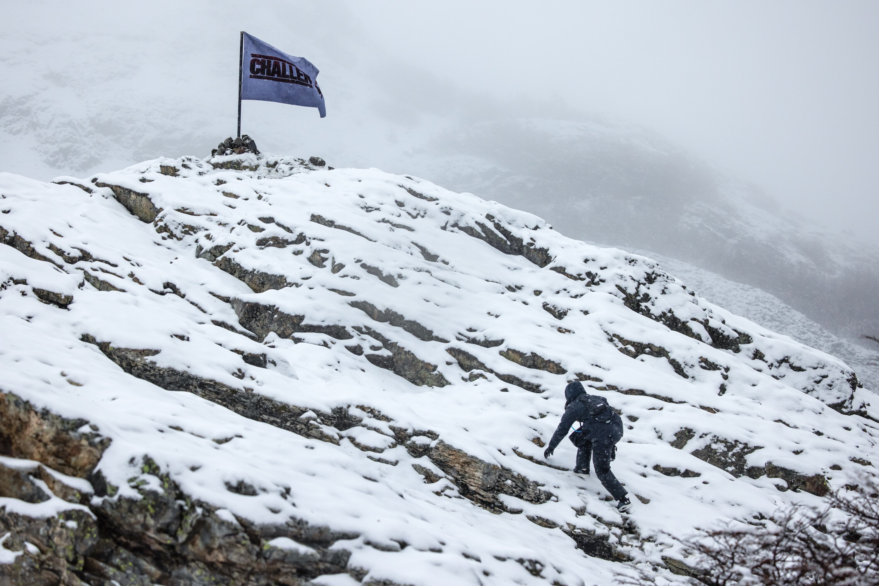 The Challenge flag on top of a mountain during 'The Challenge: USA' final