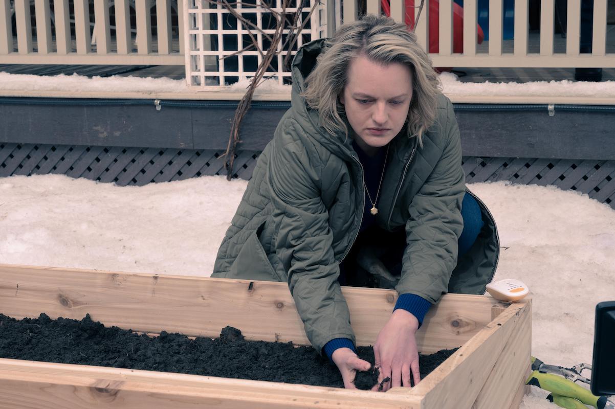 'The Handmaid's Tale': June (Elisabeth Moss) crouches and puts her hands in the dirt