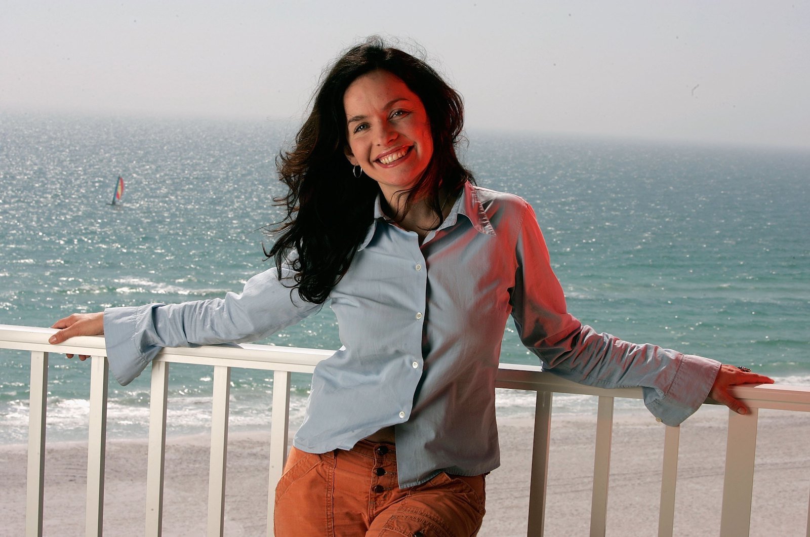 Guinevere Turner poses in front of the ocean from a balcony and would love to be part of 'The L Word Generation Q'