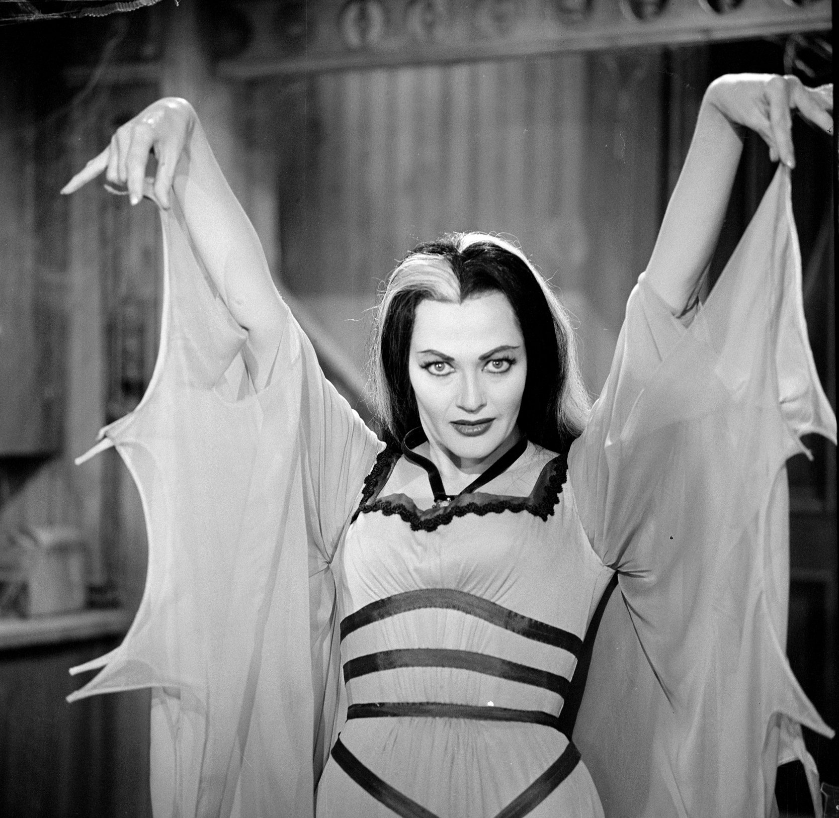 'The Munsters' star Yvonne De Carlo dressed as her character Lily Munster during a scene.