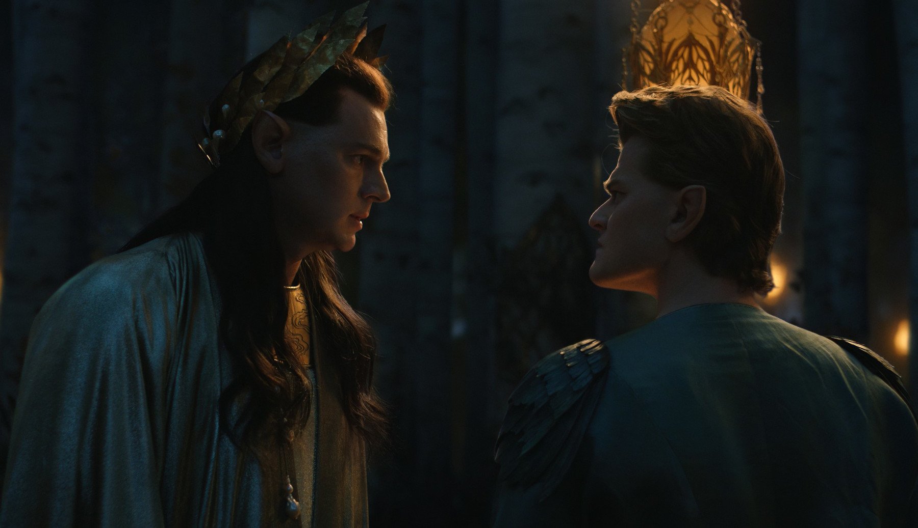 Benjamin Walker as High King Gil-galad and Robert Aramayo as Elrond in 'The Rings of Power' Episode 5 for our article about its Easter Eggs. They're looking at one another and seem unhappy.