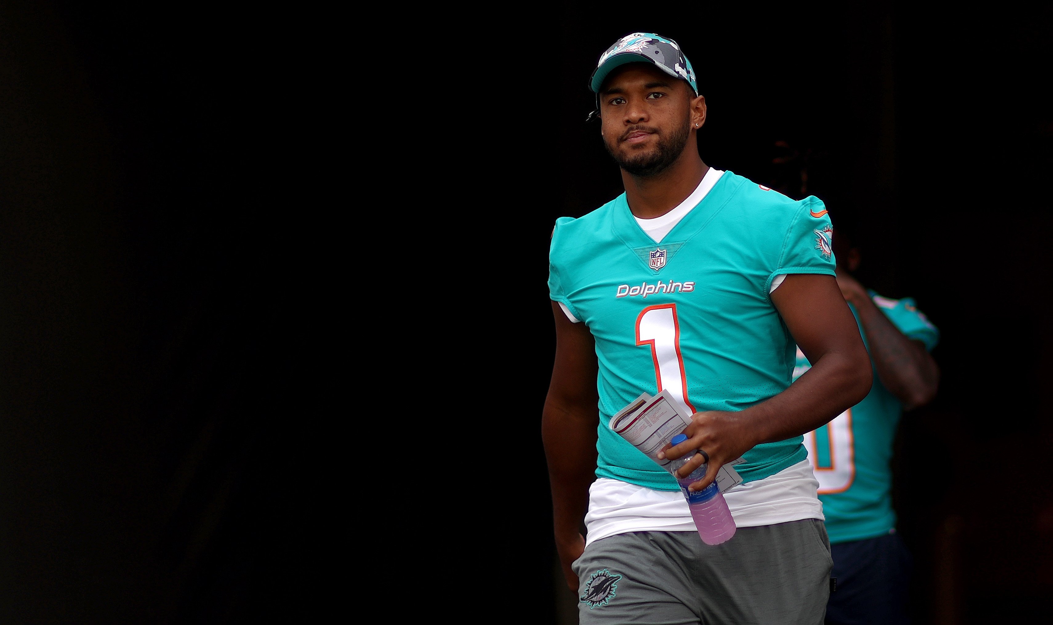 Tua Tagovailoa looks on during a preseason game against the Tampa Bay Buccaneers