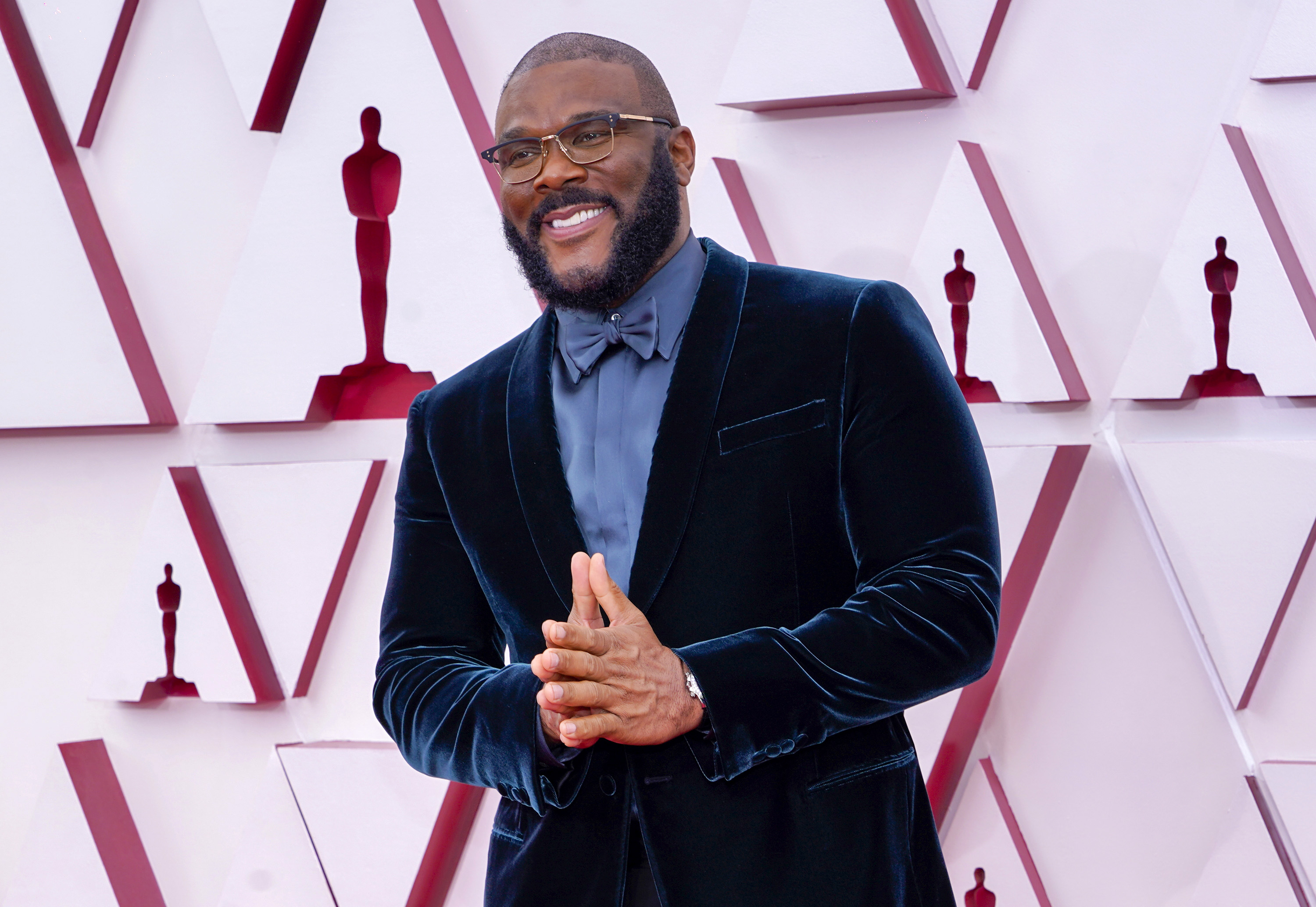 Tyler Perry attends the Oscars while wearing a blue velvet suit.