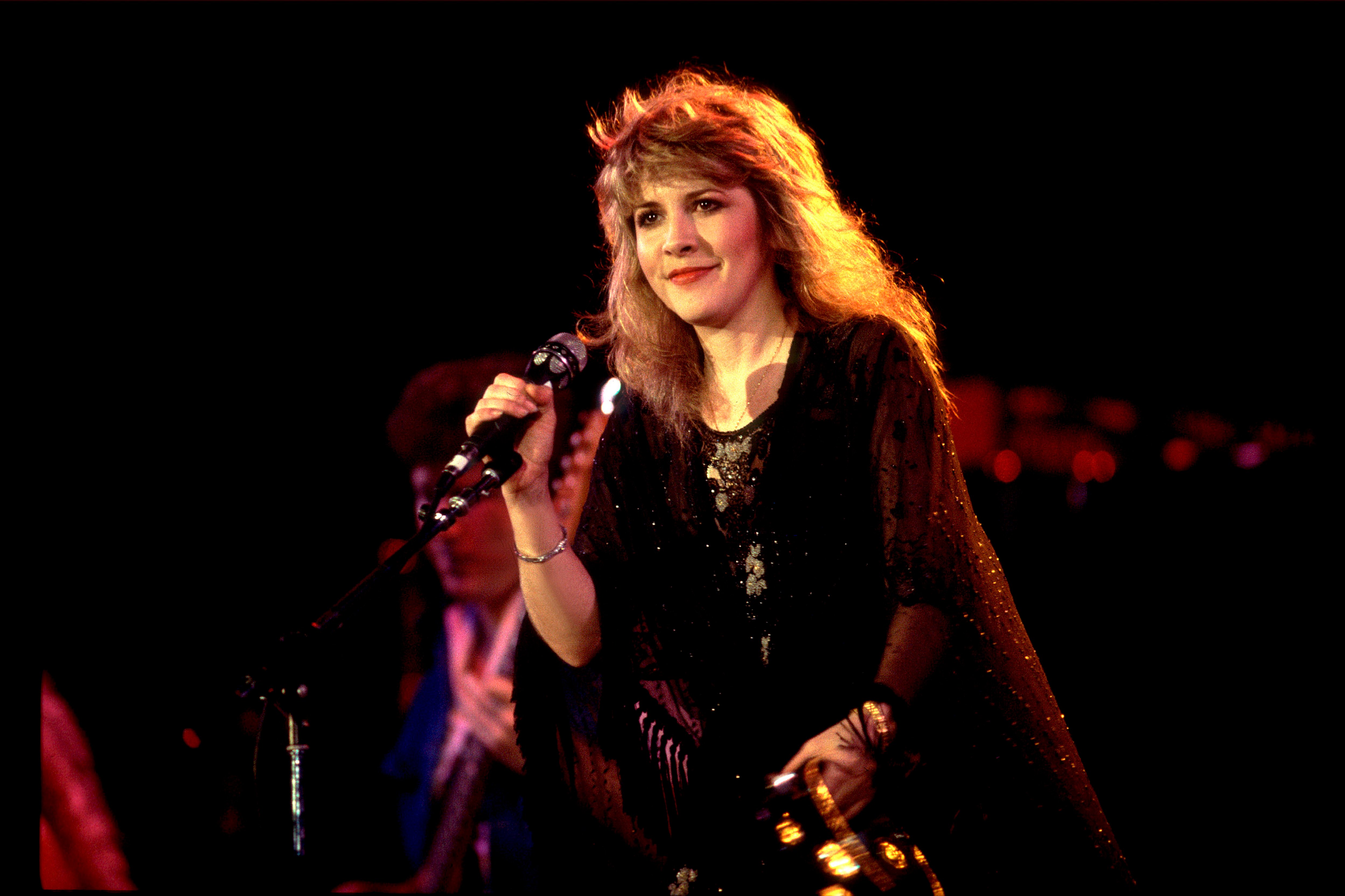 Fleetwood Mac's Stevie Nicks holding a microphone