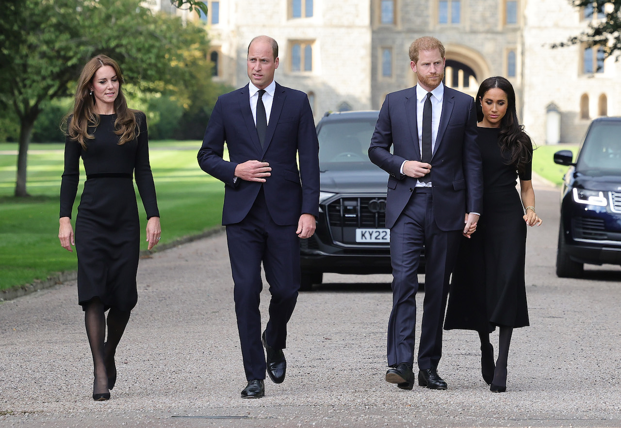Kate Middleton, Princess of Wales, Prince William, Prince of Wales, Prince Harry, Duke of Sussex, and Meghan Markle, Duchess of Sussex on the long Walk at Windsor Castle arrive to view flowers and tributes to HM Queen Elizabeth on September 10, 2022 in Windsor, England.