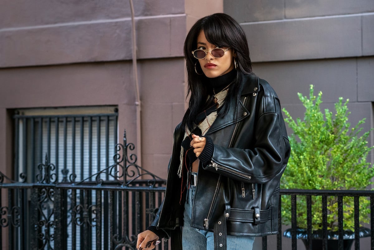 Paulina SInger as Zisa wearing a leather jacket and sunglasses in 'Power Book III: Raising Kanan'