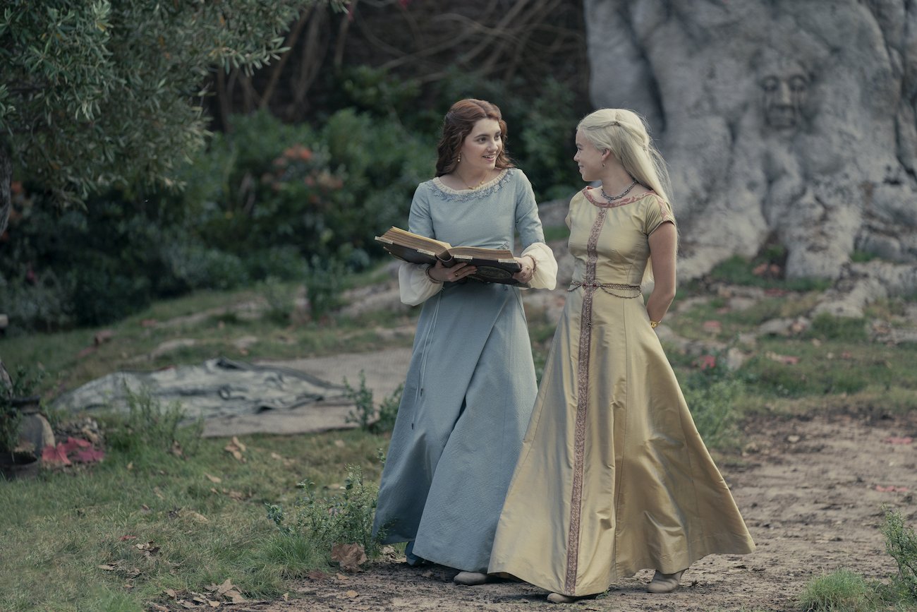 Alicent Hightower (Emily Carey) walks with Rhaenyra Targaryen (Milly Alcock) in 'House of the Dragon'