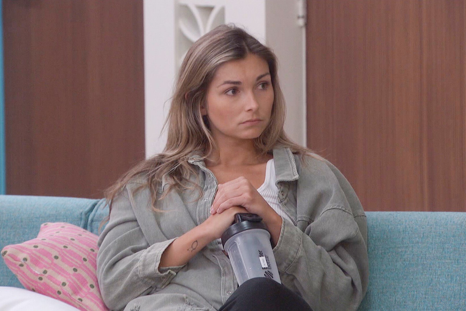 Alyssa Snider, who, according to 'Big Brother 24' spoilers, is on the block during week nine, wears a light green/gray jacket over a white tank top and black pants.