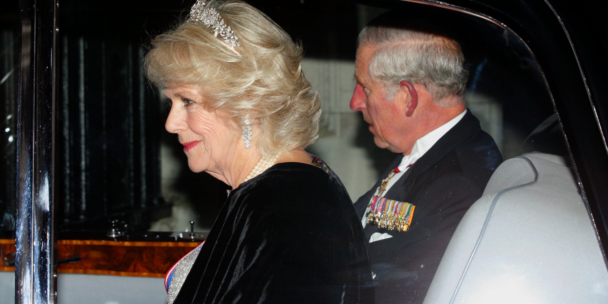 Camilla Parker Bowles and Prince Charles arrive at Buckingham Palace to attend a reception hosted by Queen Elizabeth II for Members of the Diplomatic Corps on December 2, 2014 in London, England.