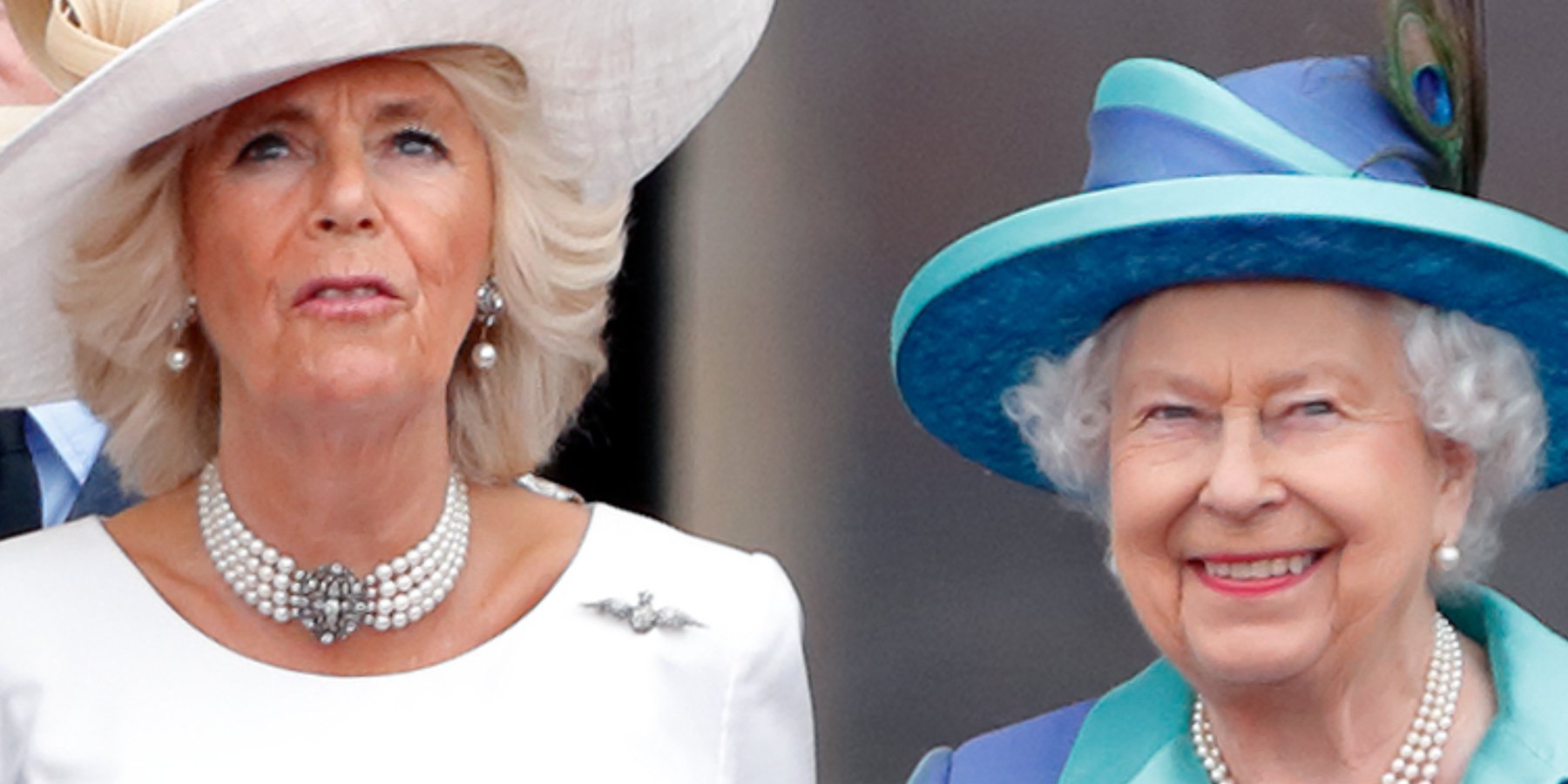 Camilla Parker Bowles and Queen Elizabeth watch a flypast to mark the centenary of the Royal Air Force from the balcony of Buckingham Palace on July 10, 2018 in London, England.