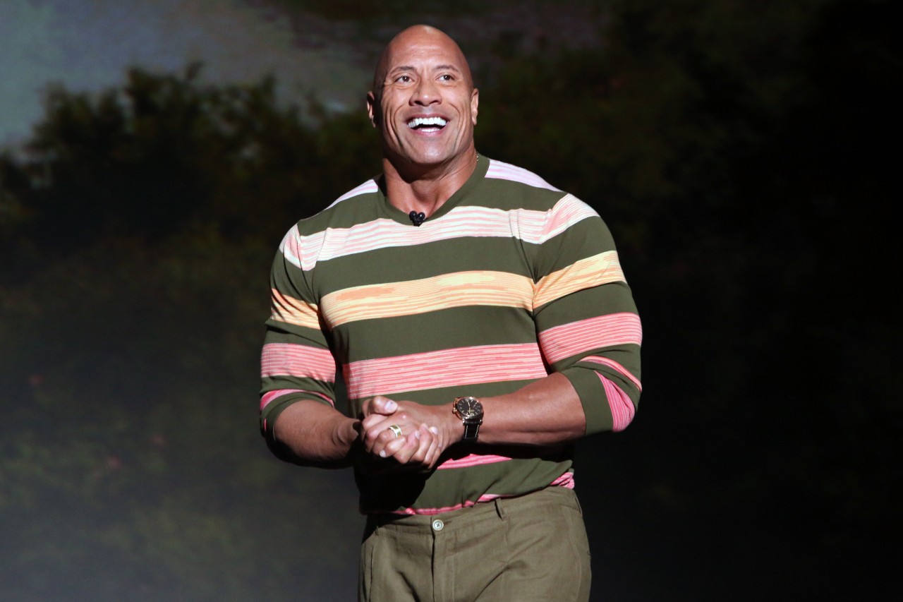 Dwayne Johnson speaks at a media event.