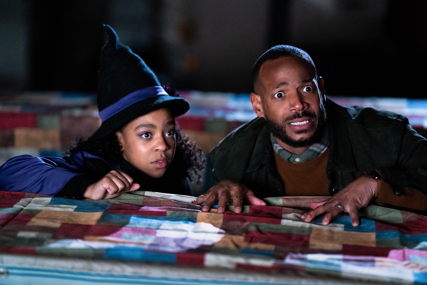 One of the horror movies premiering on Netflix in October stars Marlon Wayans and Priah Ferguson, seen here in a production still from the film.