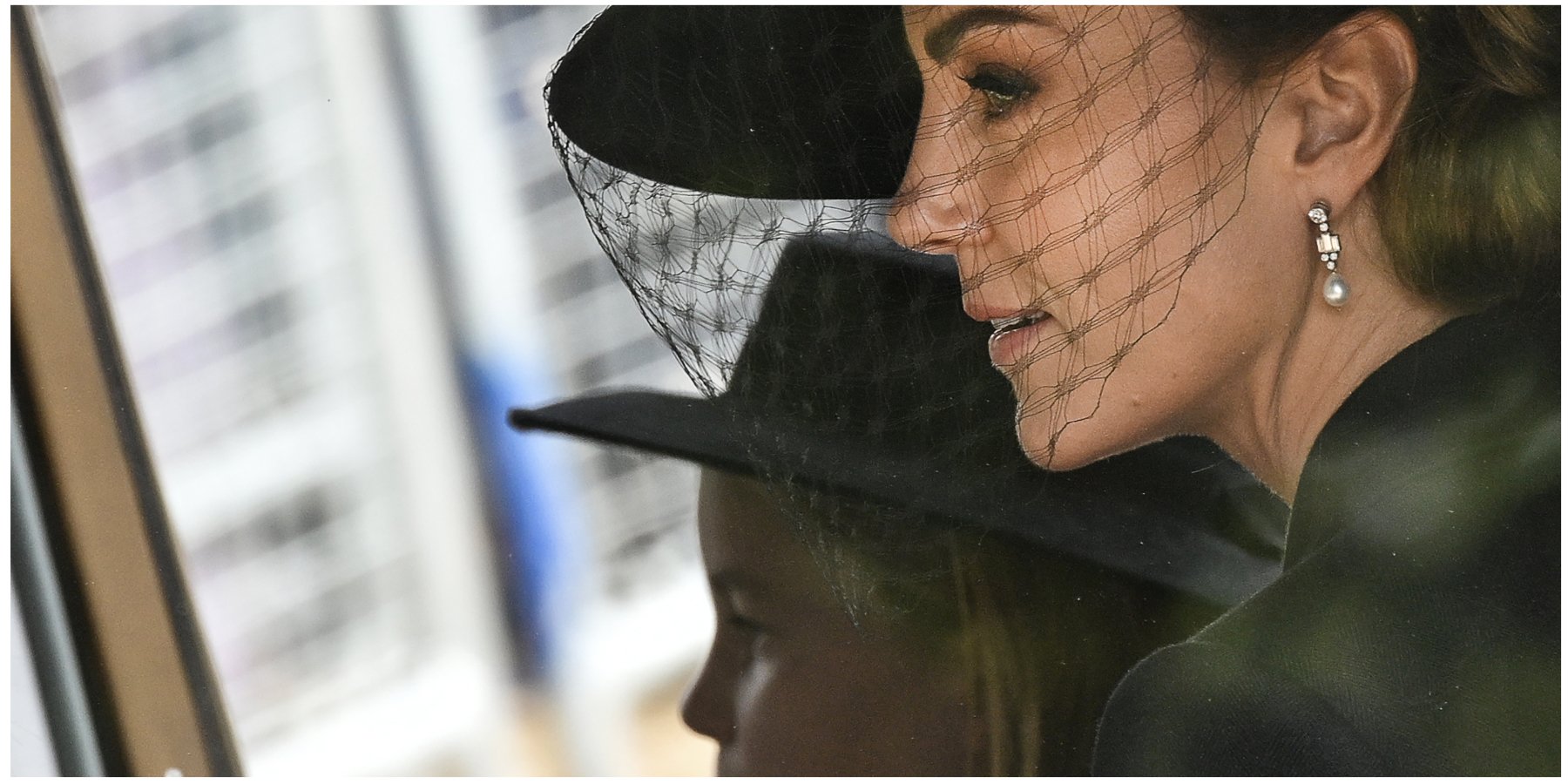 Kate Middleton and her daughter Princess Charlotte ride in a car to Queen Elizabeth's funeral service in 2022.