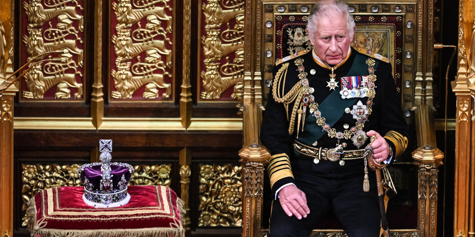 King Charles sits next to the Imperial State Crown during the State Opening of Parliament in the House of Lords at the Palace of Westminster on May 10, 2022 in London, England.