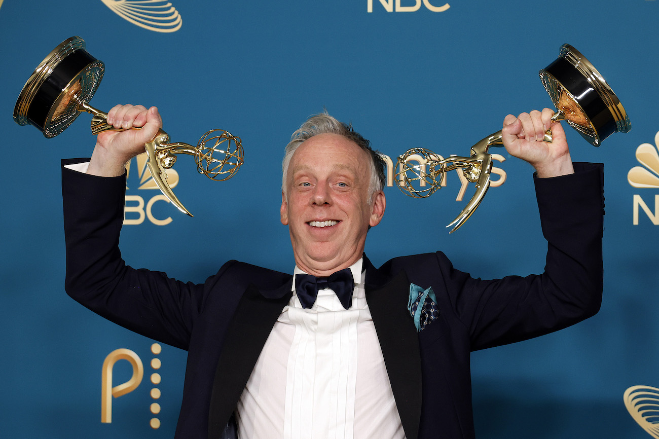 Mike White, who has several credits for movies and tv shows, holding his Emmy Awards