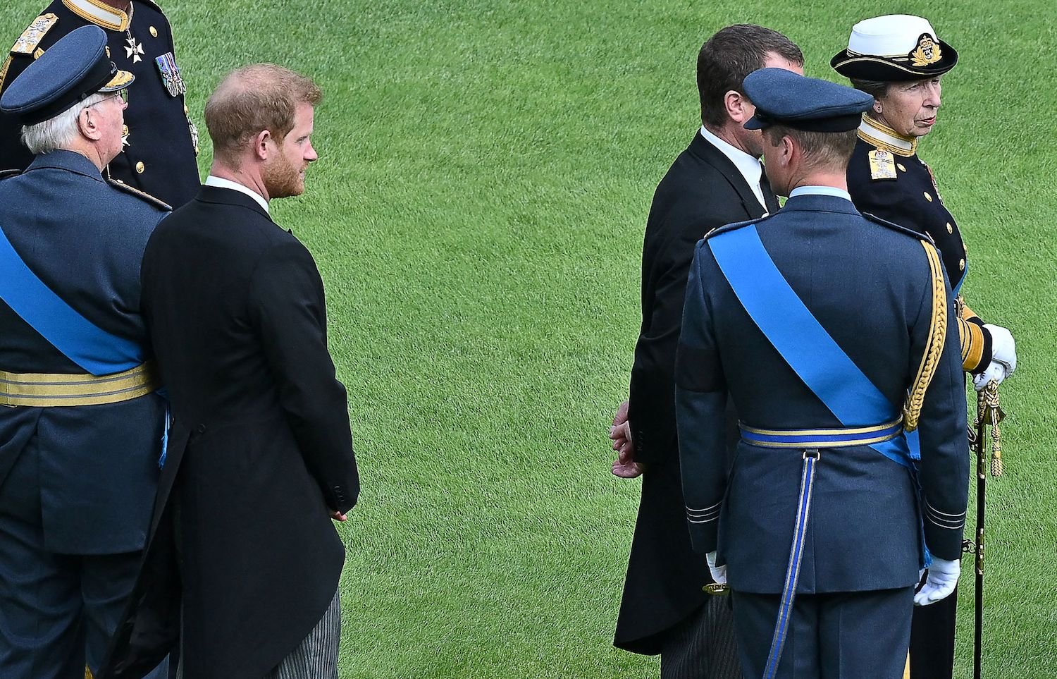 Prince Harry and Prince William body language at Queen Elizabeth funeral waiting to join procession