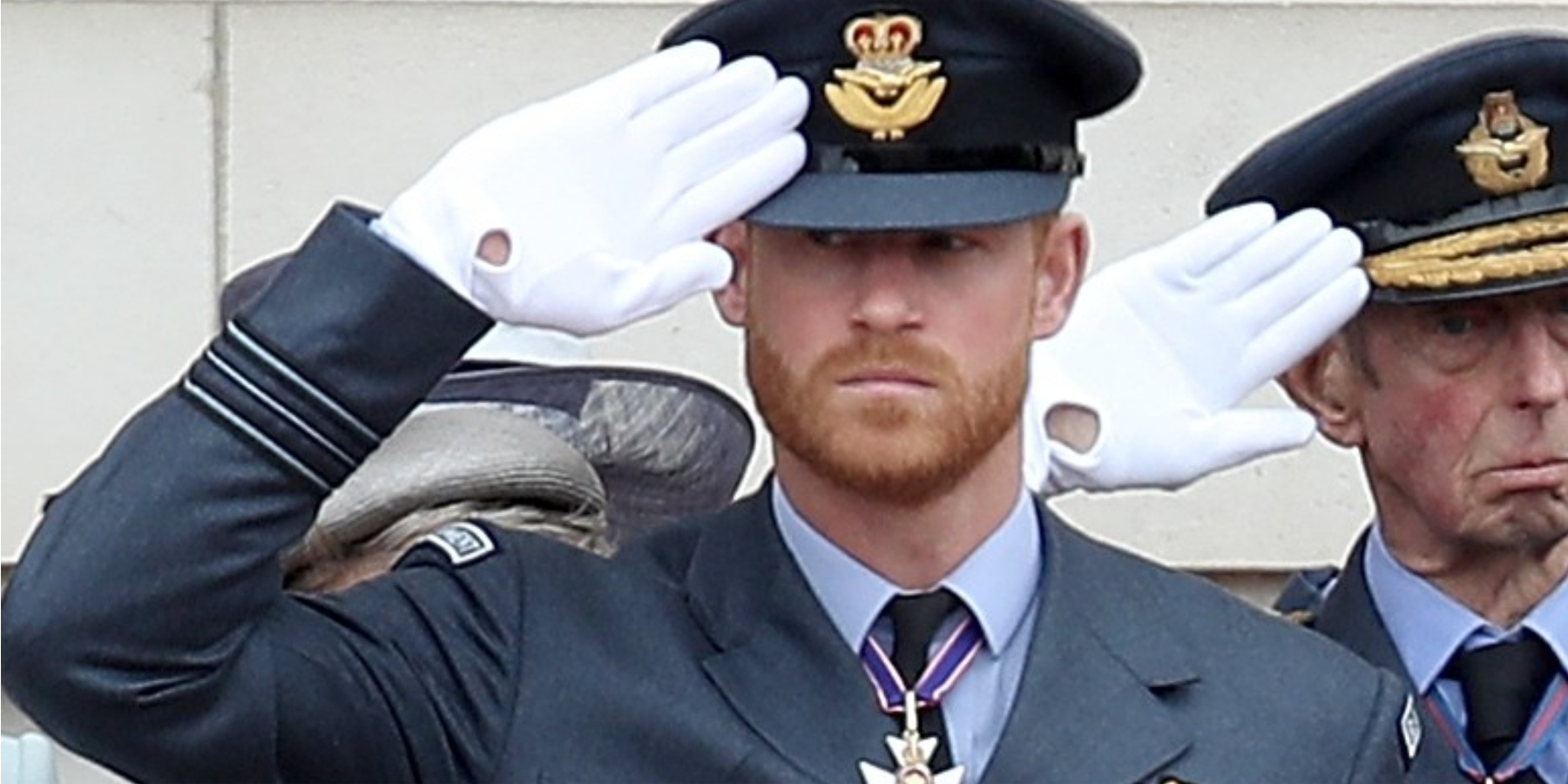 Prince Harry salutes wearing his full military uniform in a photo taken in 2018.