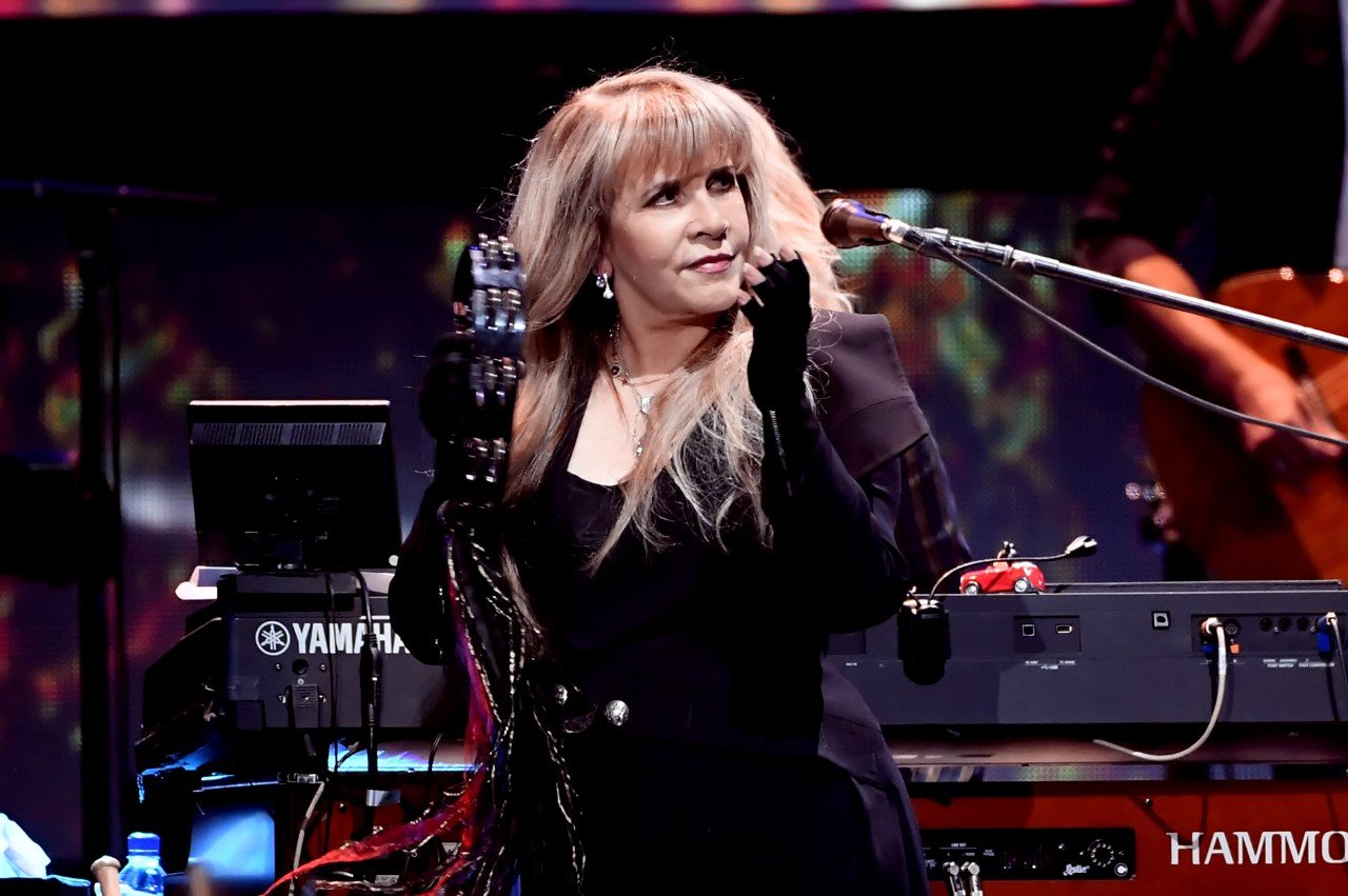 Stevie Nicks plays her tambourine.