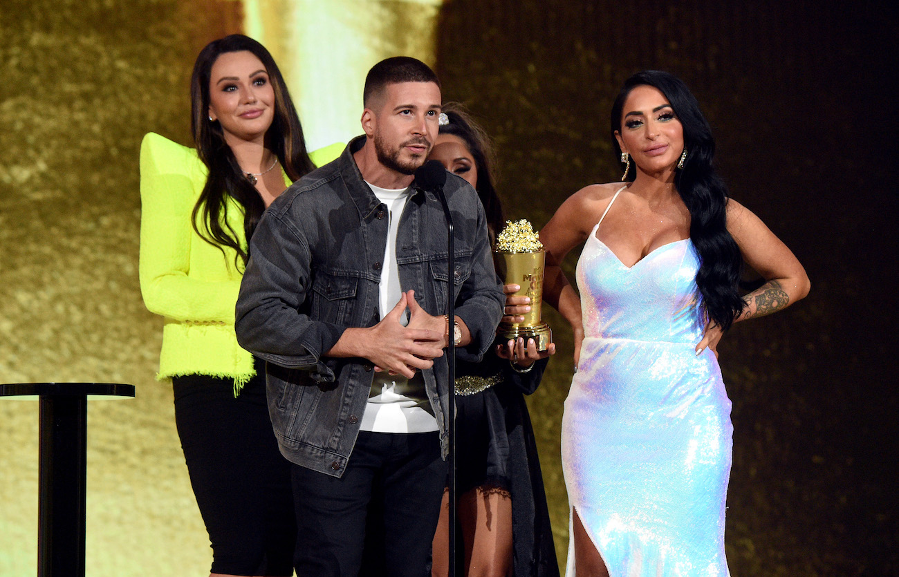 Jenni 'JWoww' Farley, Vinny Guadagnino, Nicole 'Snooki' Polizzi, and Angelina Pivarnick of 'Jersey Shore: Family Vacation' accepting their honor at the MTV Movie and TV Awards