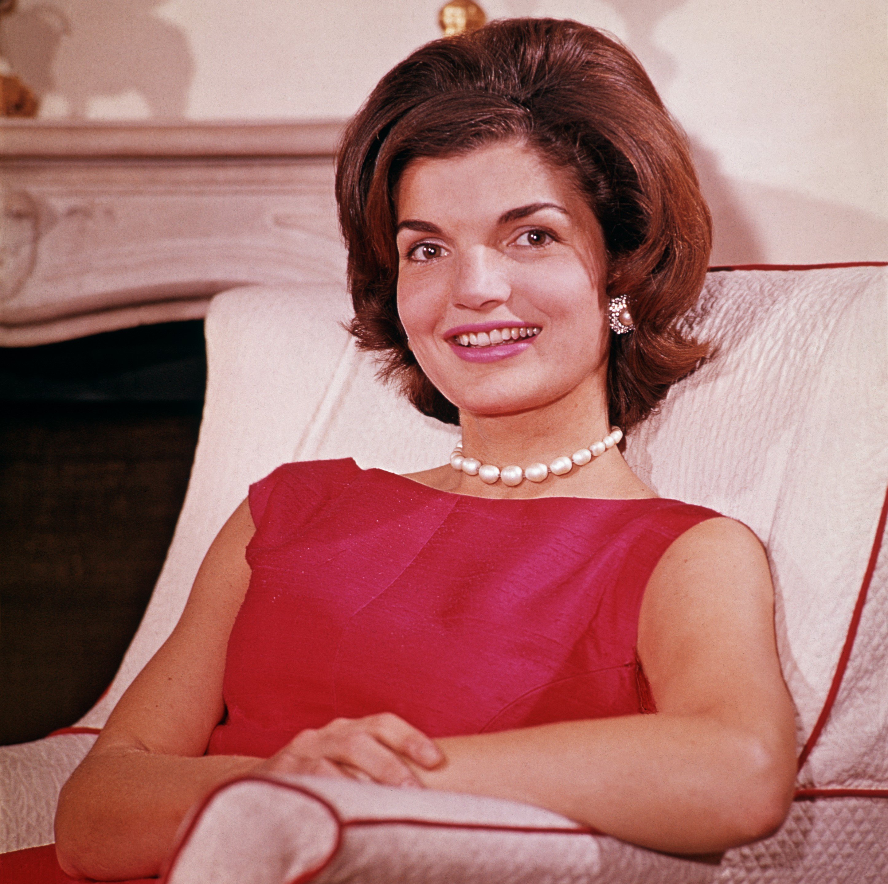 Jackie Kennedy wearing a red dress