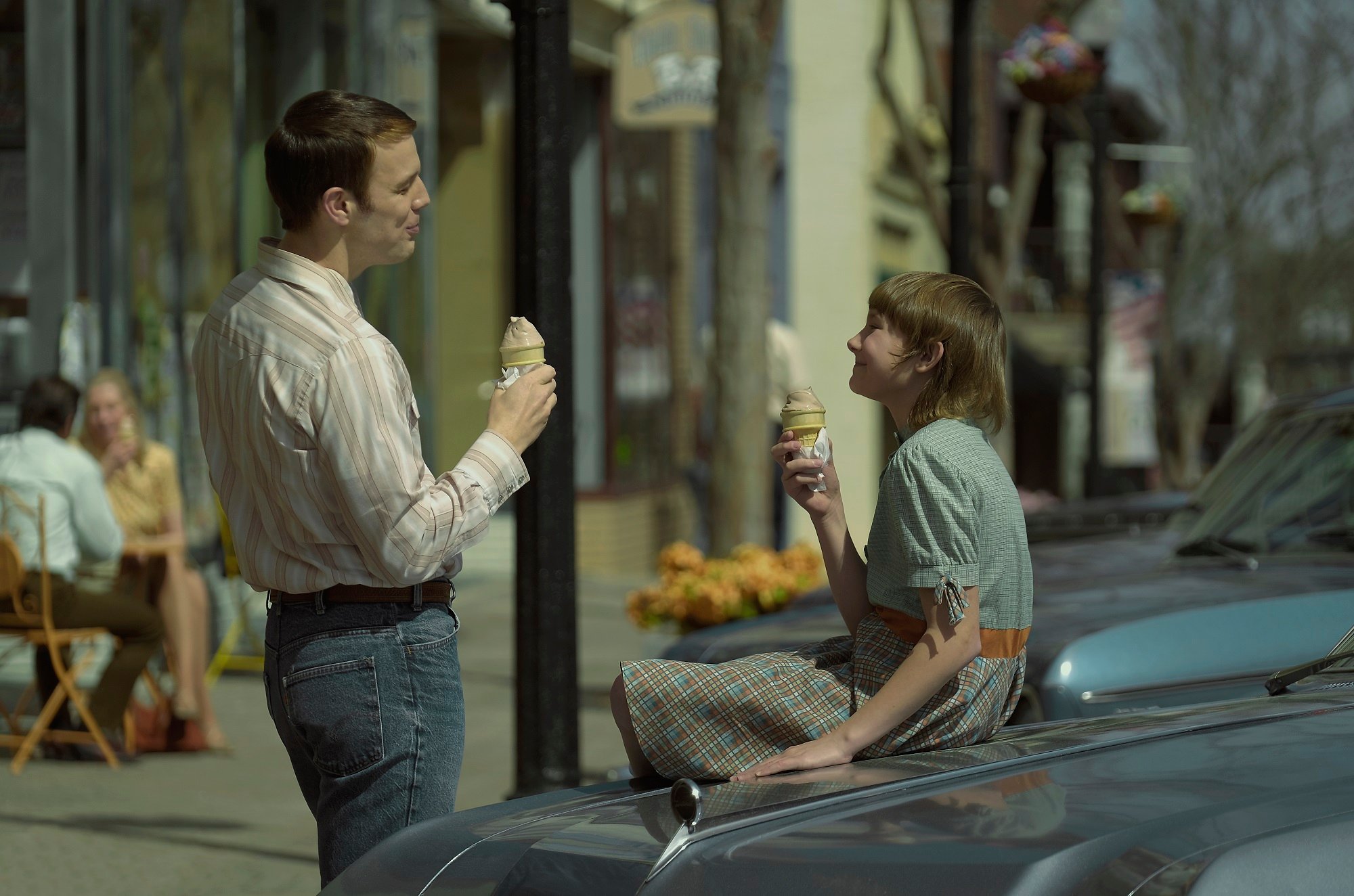 'A Friend of the Family' Jake Lacy as Robert Berchtold and Hendrix Yancey as young Jan Broberg eating ice cream together