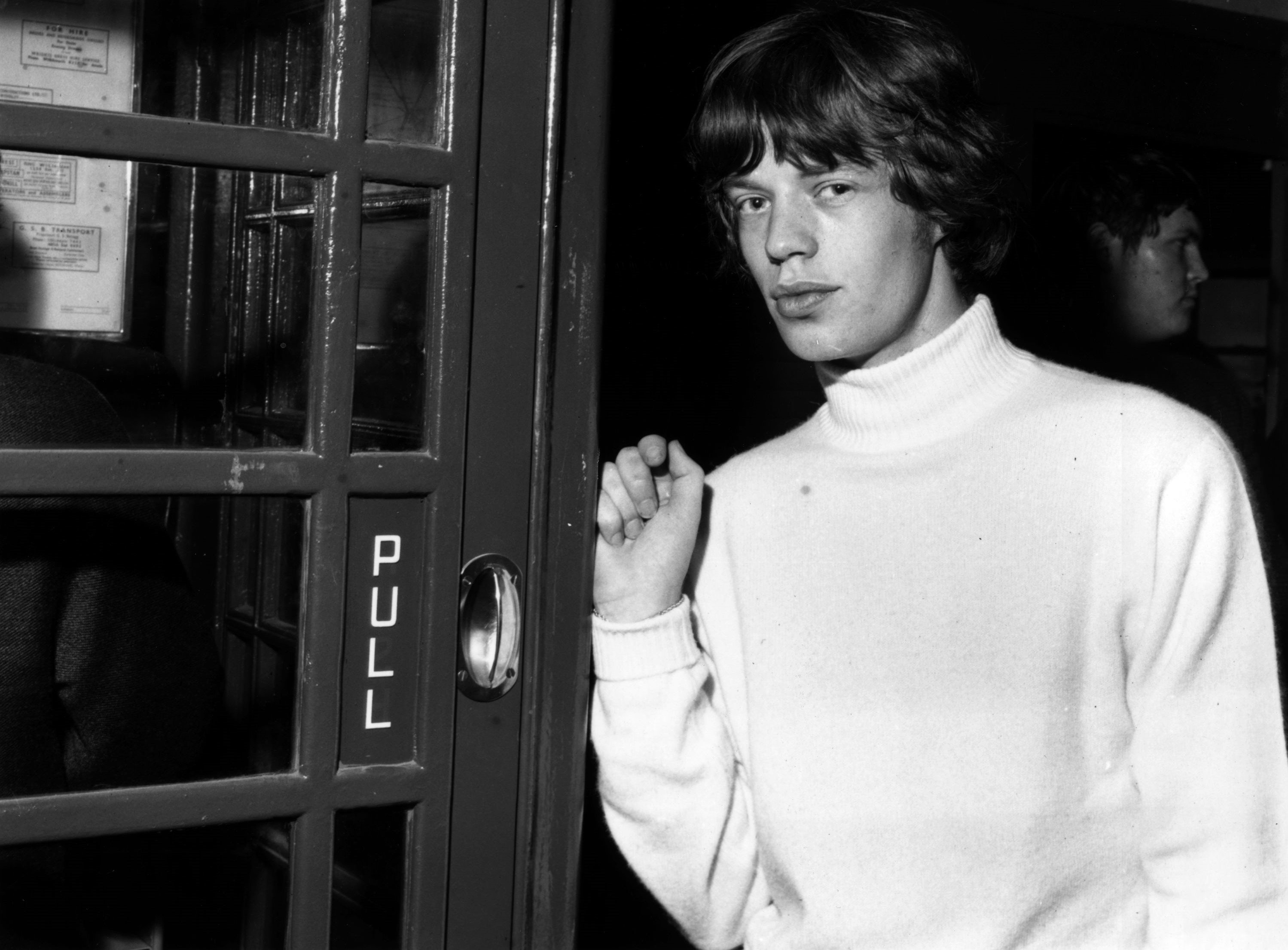 The Rolling Stones’ Mick Jagger near a door