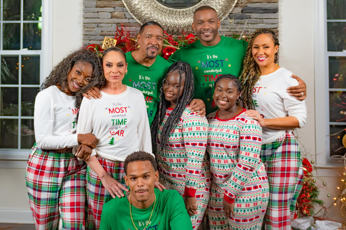 Family wearing Christmas pajamas in the BET+ Christmas movie 'A Wesley Christmas'