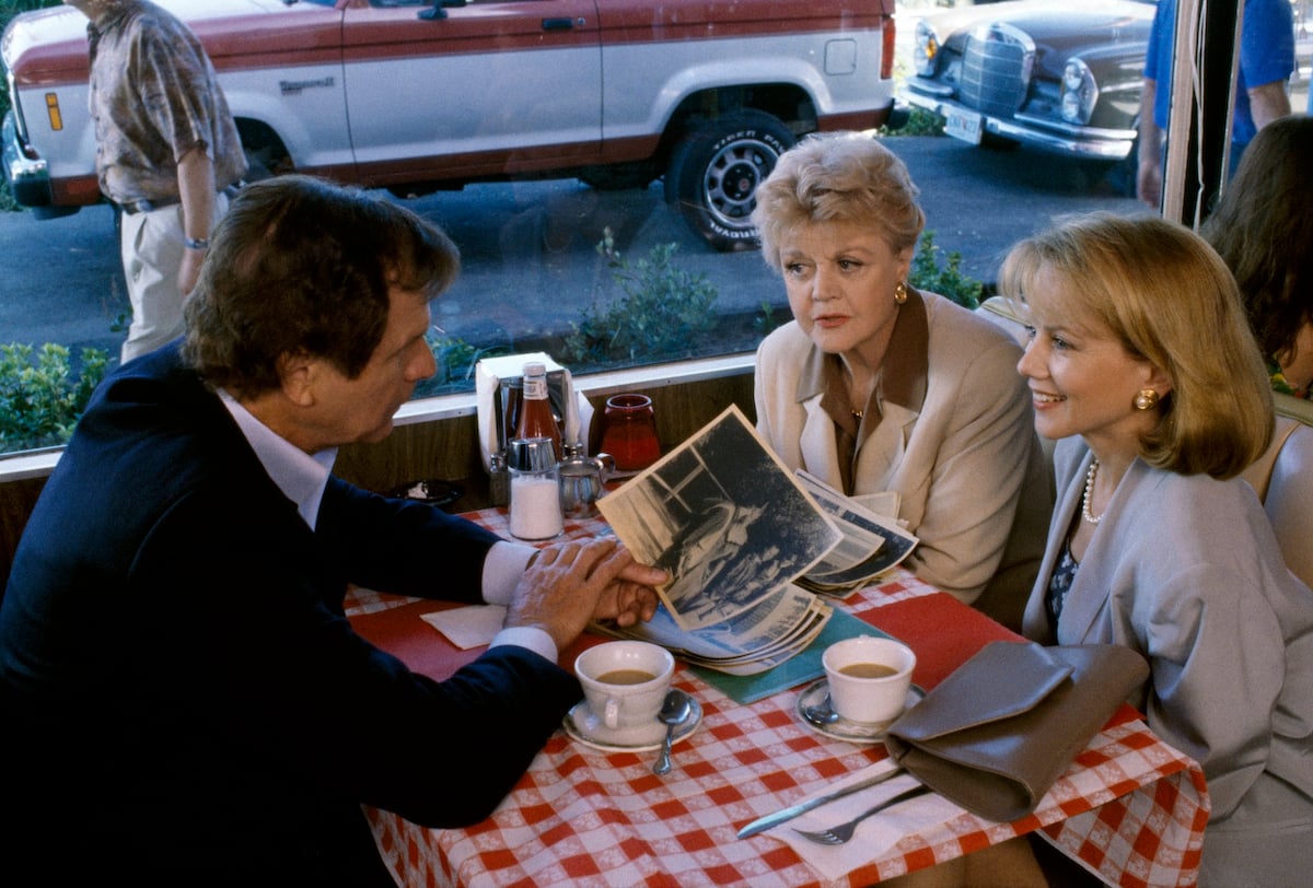 Angela Lansbury as Jessica Fletcher, sitting in a restaurant in 'Murder, She Wrote'