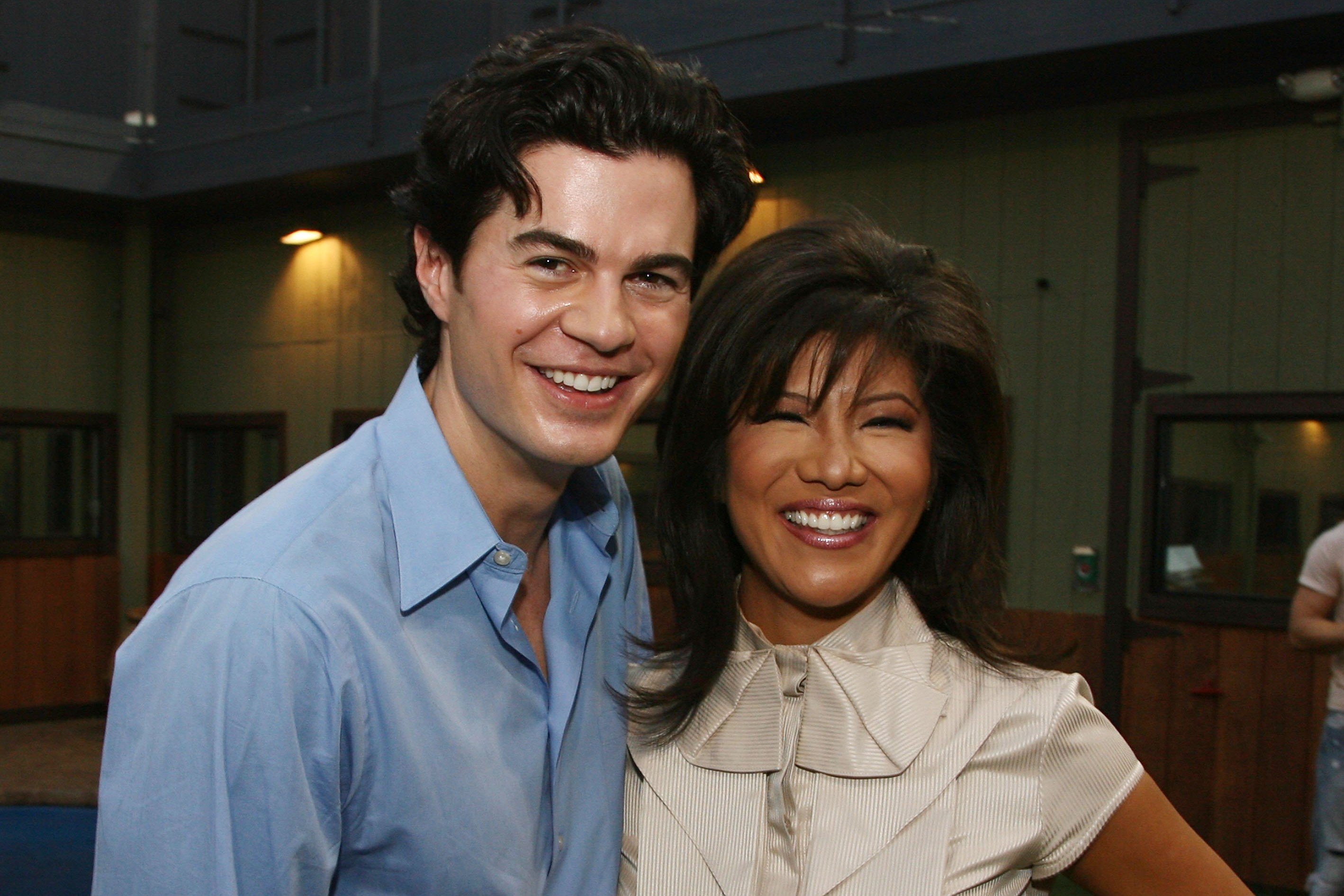 Will Kirby, the winner of 'Big Brother 2,' and Julie Chen Moonves, the host of 'Big Brother' on CBS, pose for pictures at the 'Big Brother 7' finale. Will wears a light blue button-up shirt. Julie wears a white blouse.