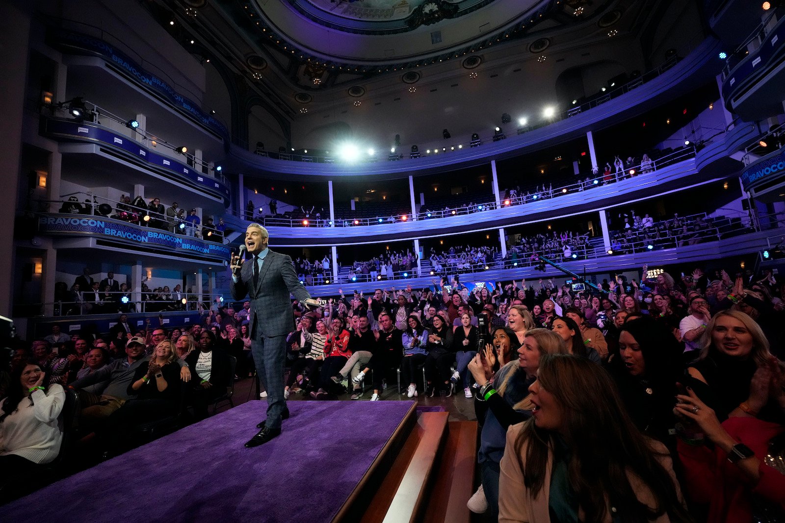 Andy Cohen in front of a crowd at BravoCon 2022