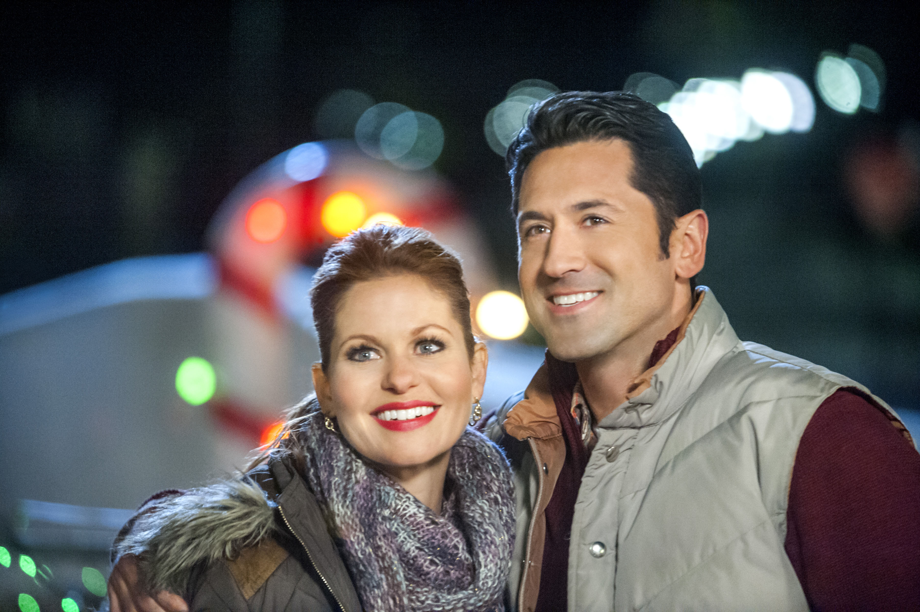 Smiling Candace Cameron Bure and David O'Donnell in 'Christmas Under Wraps'