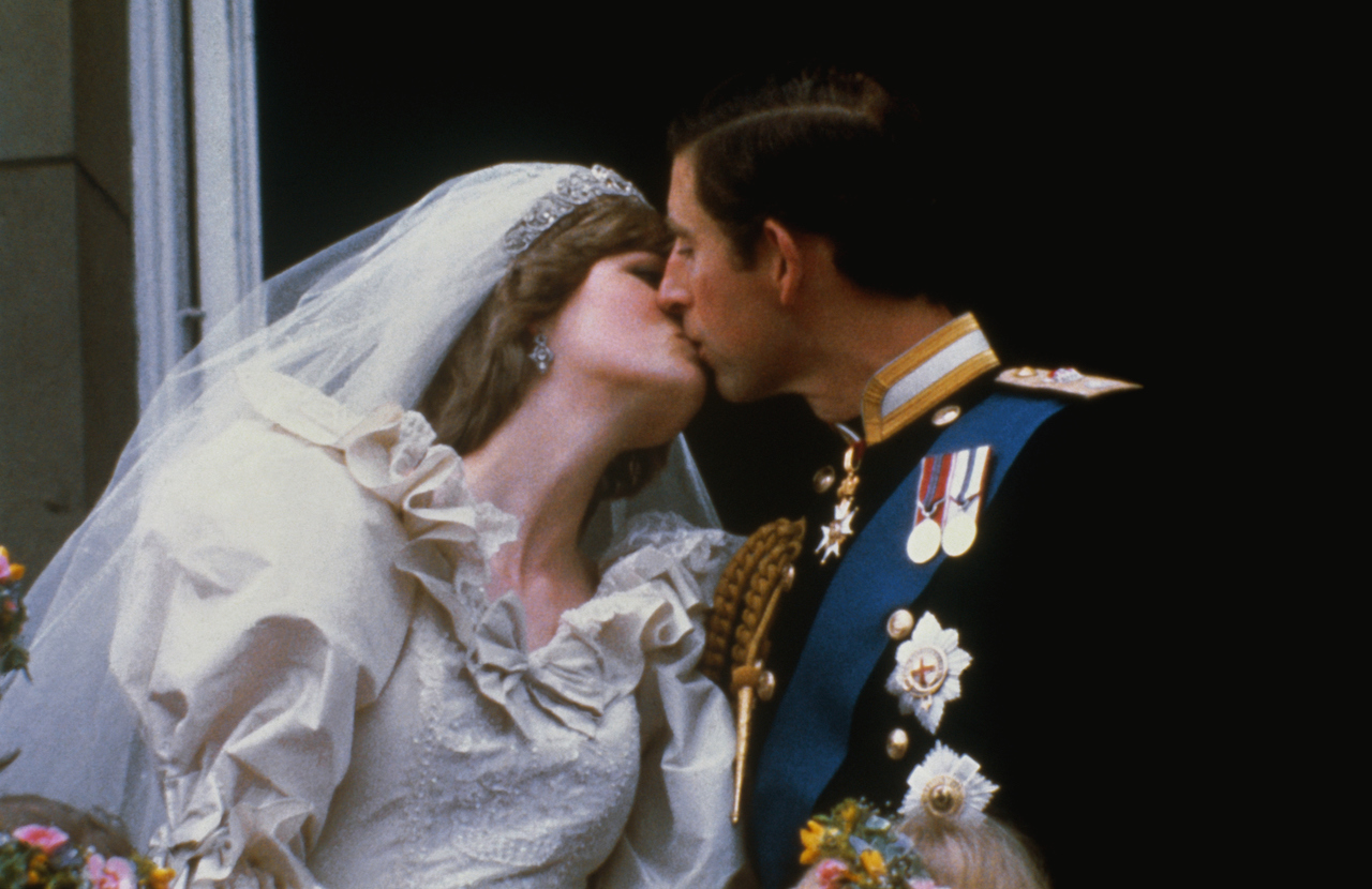 Wedding of Prince Charles and Lady Diana Spencer. Shows the famous kiss on the balcony of Buckingham Palace, after ceremony.