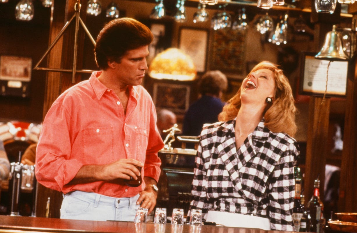 'Cheers': Shelley Long laughs standing behind the bar with Ted Danson