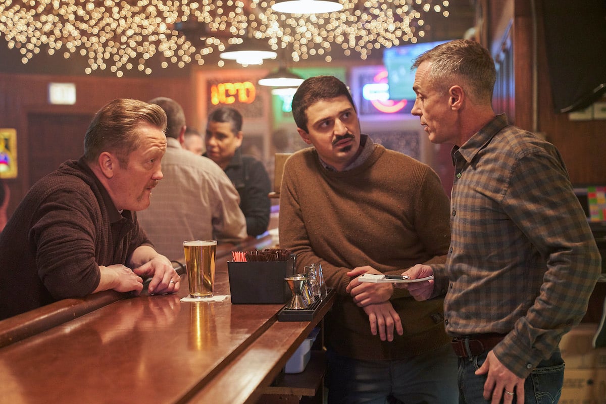 'Chicago Fire' cast members sitting around the bar at Molly's