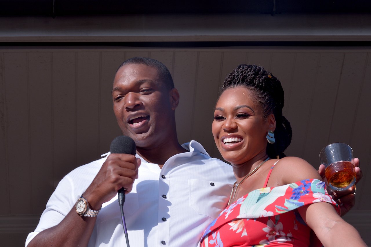 Chris Samuels and Monique Samuels smile during toast on 'RHOP' filming; Monique says she and Chris live in separate houses
