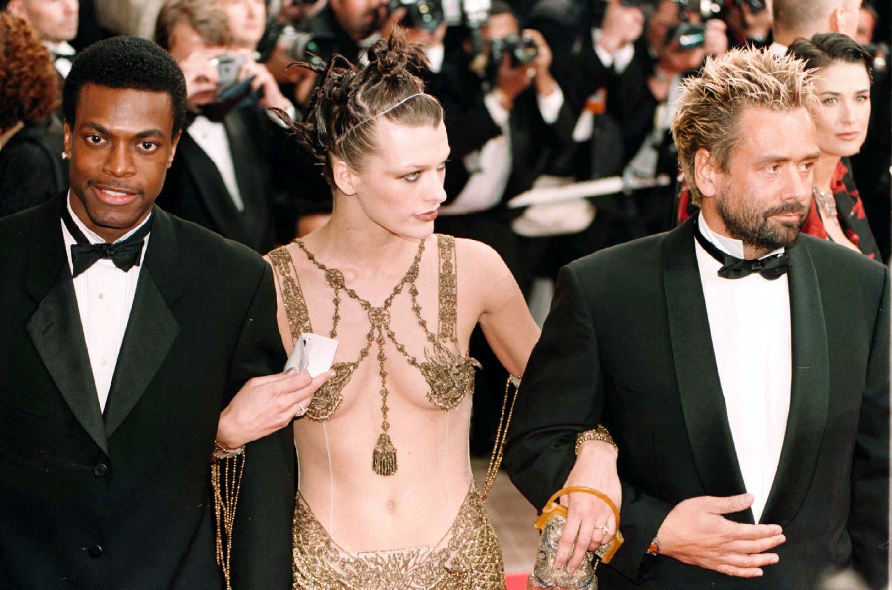 Chris Tucker, Milla Jovovich, and Luc Besson at 'The Fifth Element' premiere at the 50th Cannes Film Festival
