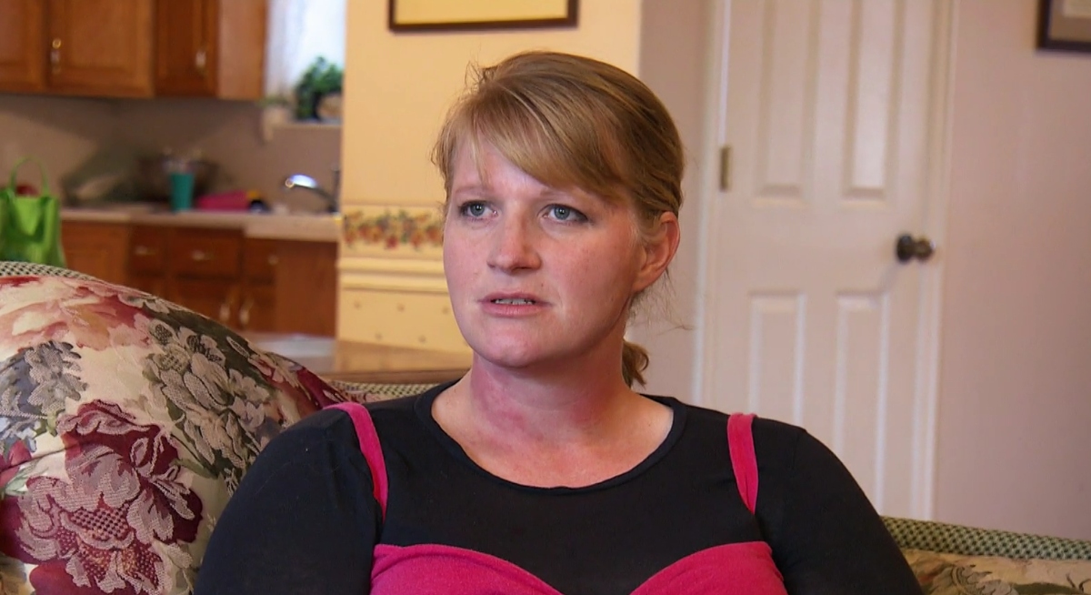 Christine Brown in 'Sister Wives' Season 1 wearing a black shirt with a pink tank top on the TLC show.